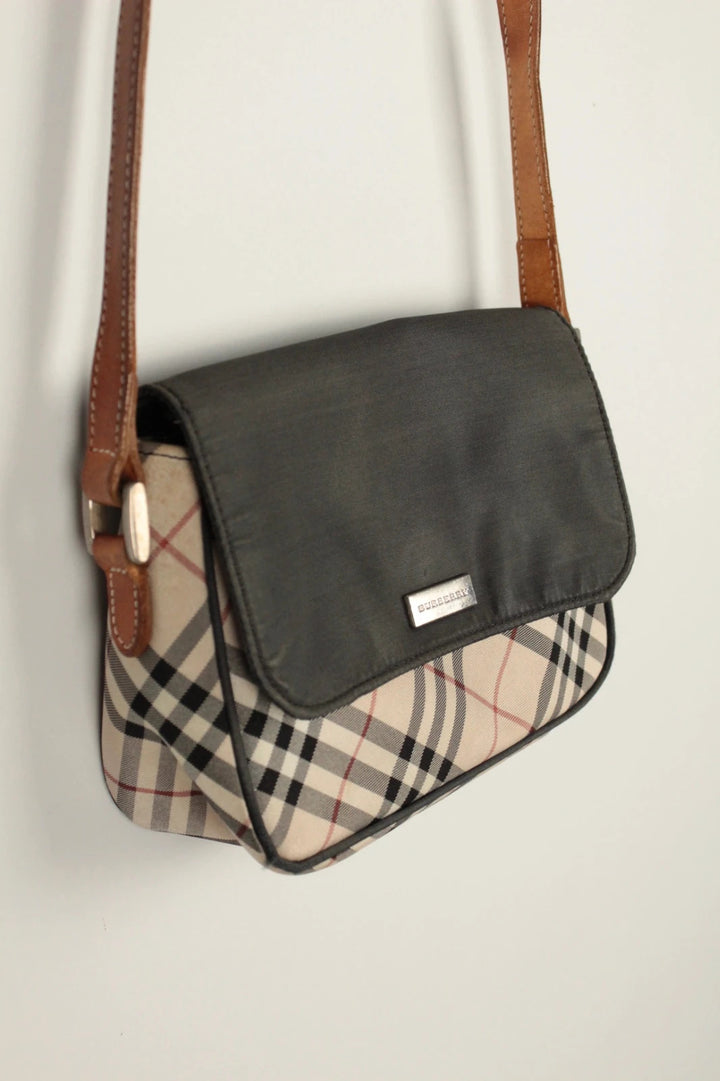 Burberry beige Nova Check crossbody handbag with black nylon flap and leather strap.