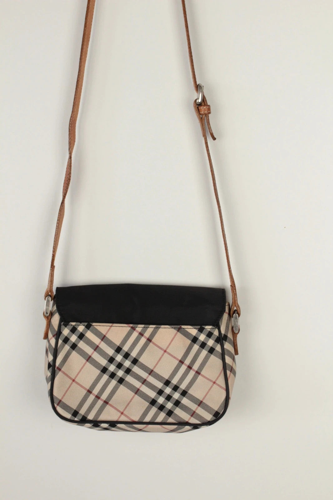 Burberry beige Nova Check crossbody handbag with black nylon flap and leather strap.