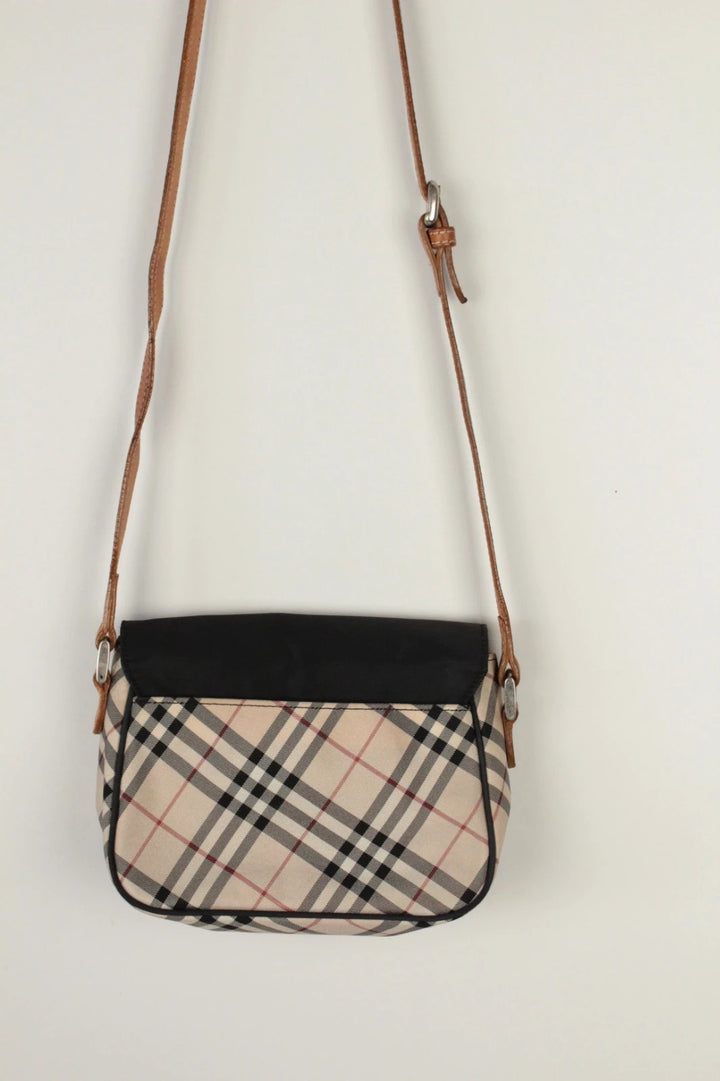 Burberry beige Nova Check crossbody handbag with black nylon flap and leather strap.