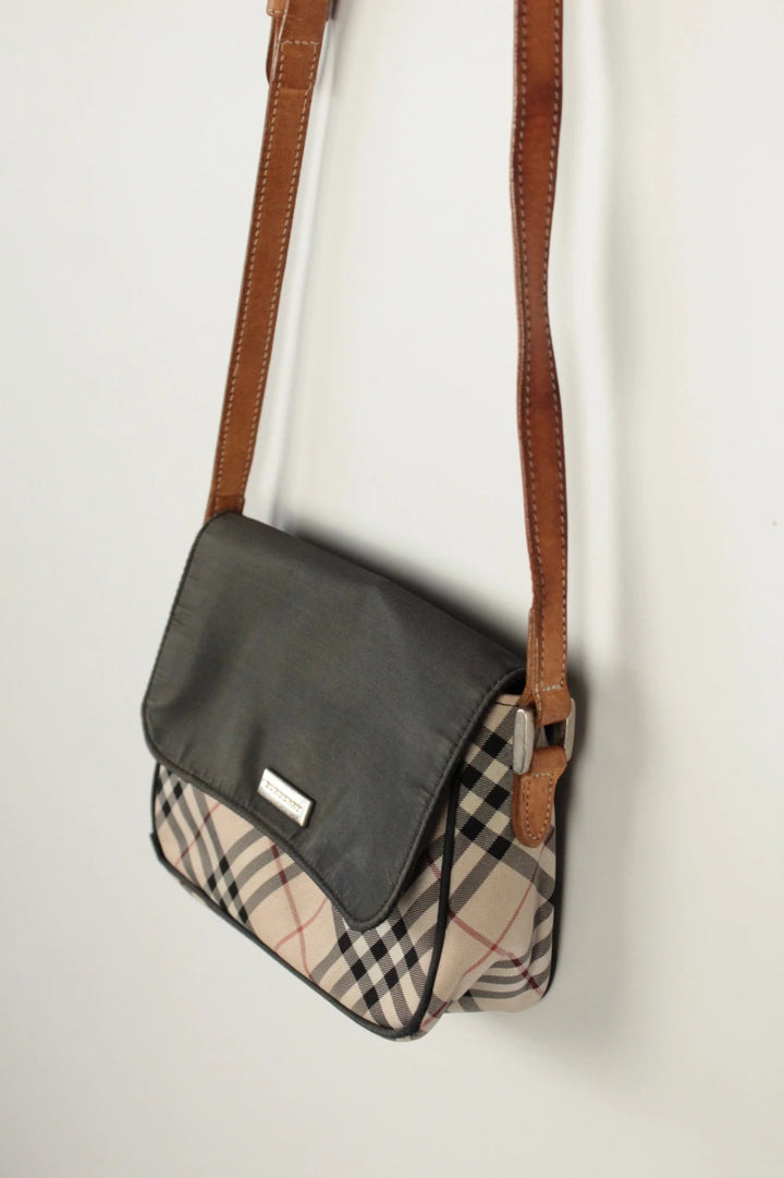 Burberry beige Nova Check crossbody handbag with black nylon flap and leather strap.