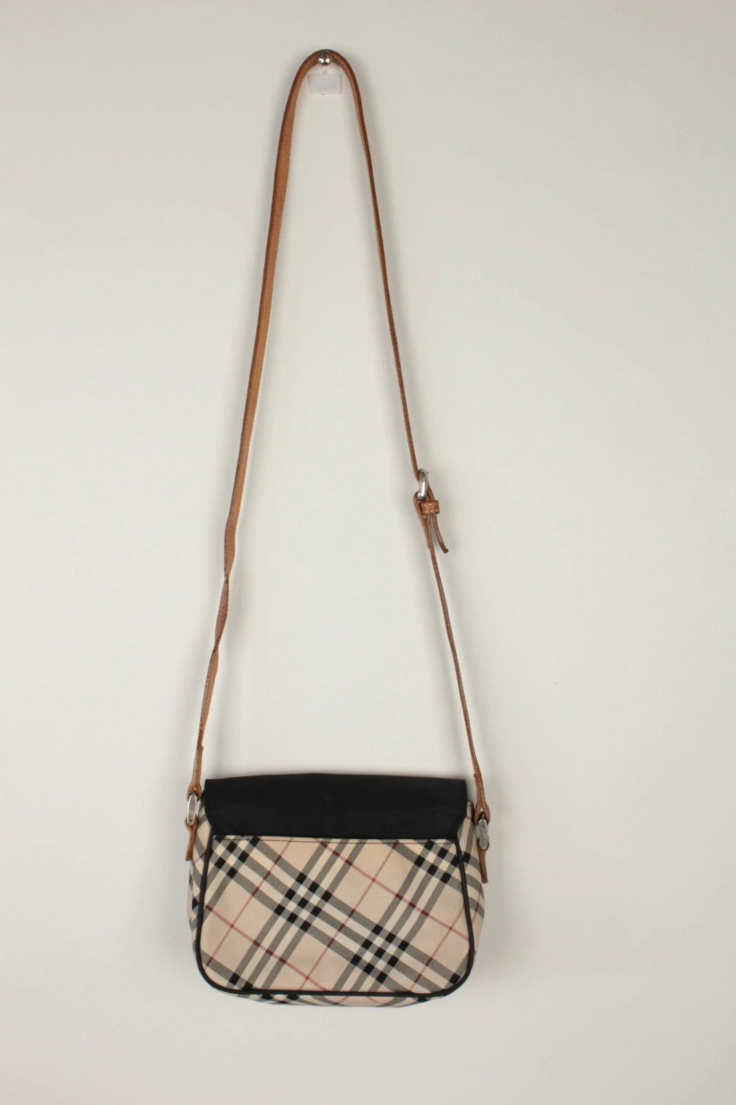 Burberry beige Nova Check crossbody handbag with black nylon flap and leather strap.