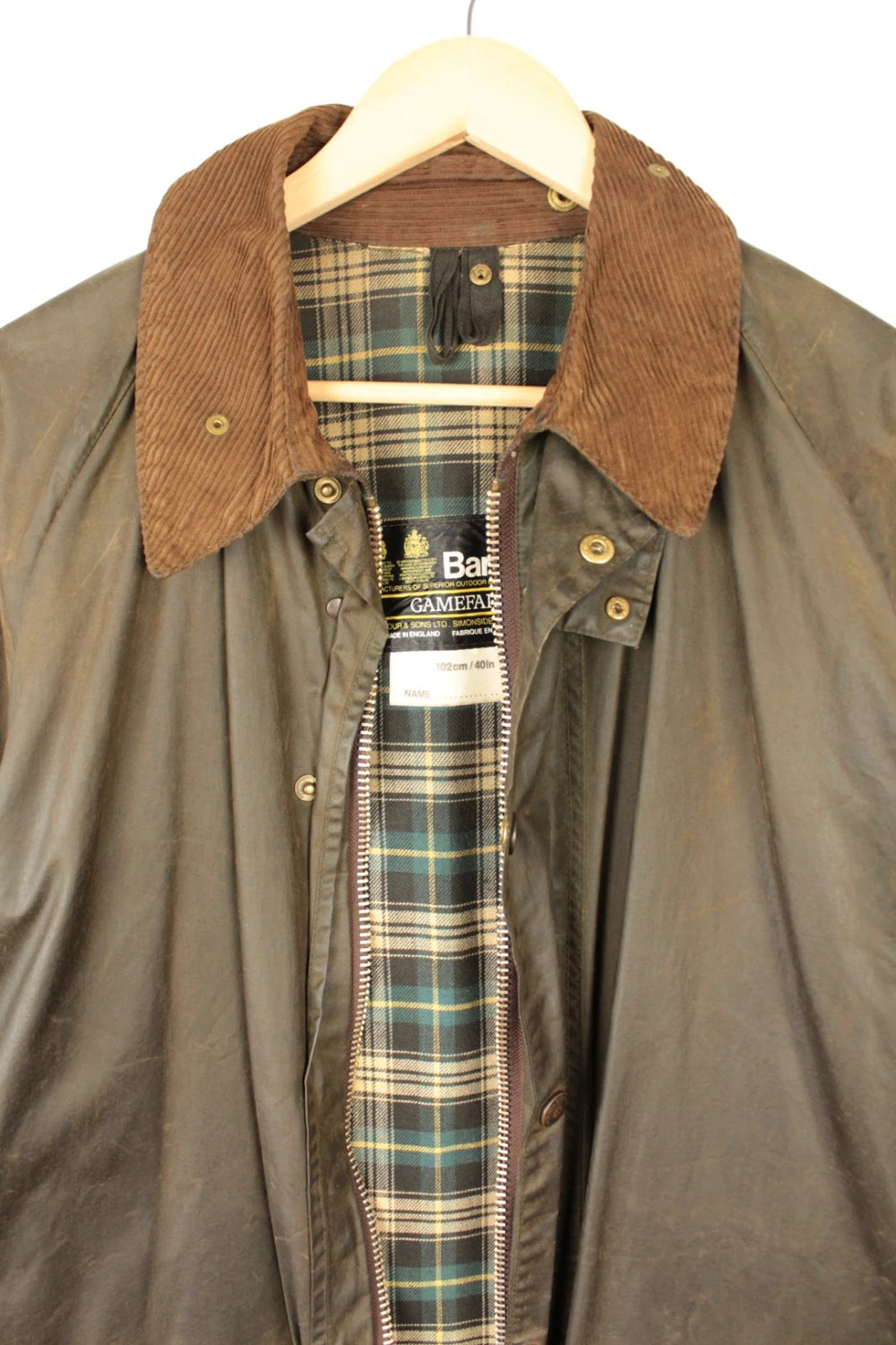 Barbour khaki wax jacket with corduroy collar and 2-Crest inner label.