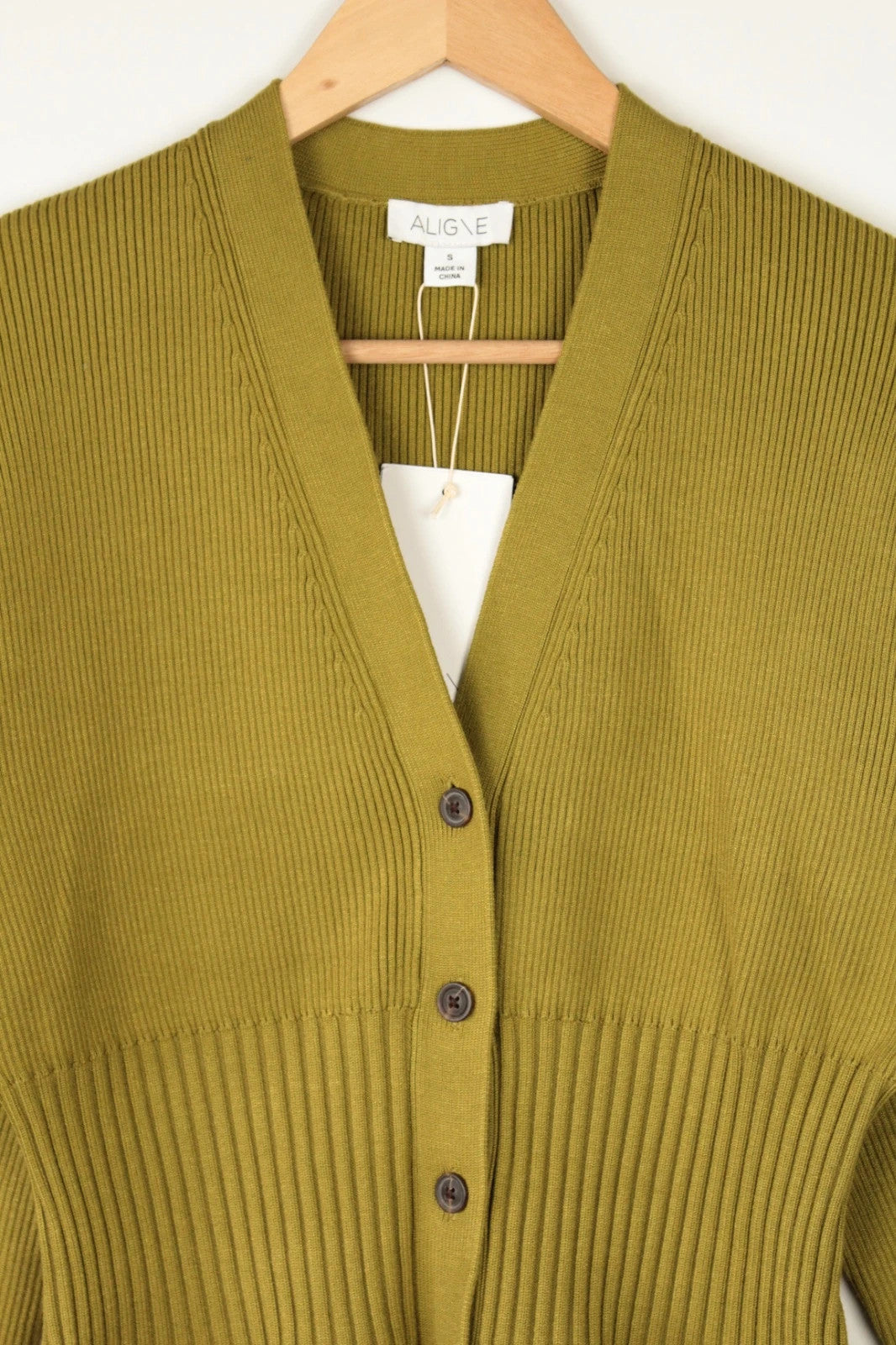 Aligne khaki knit cardigan with flawless stitch details and hardware buttons.