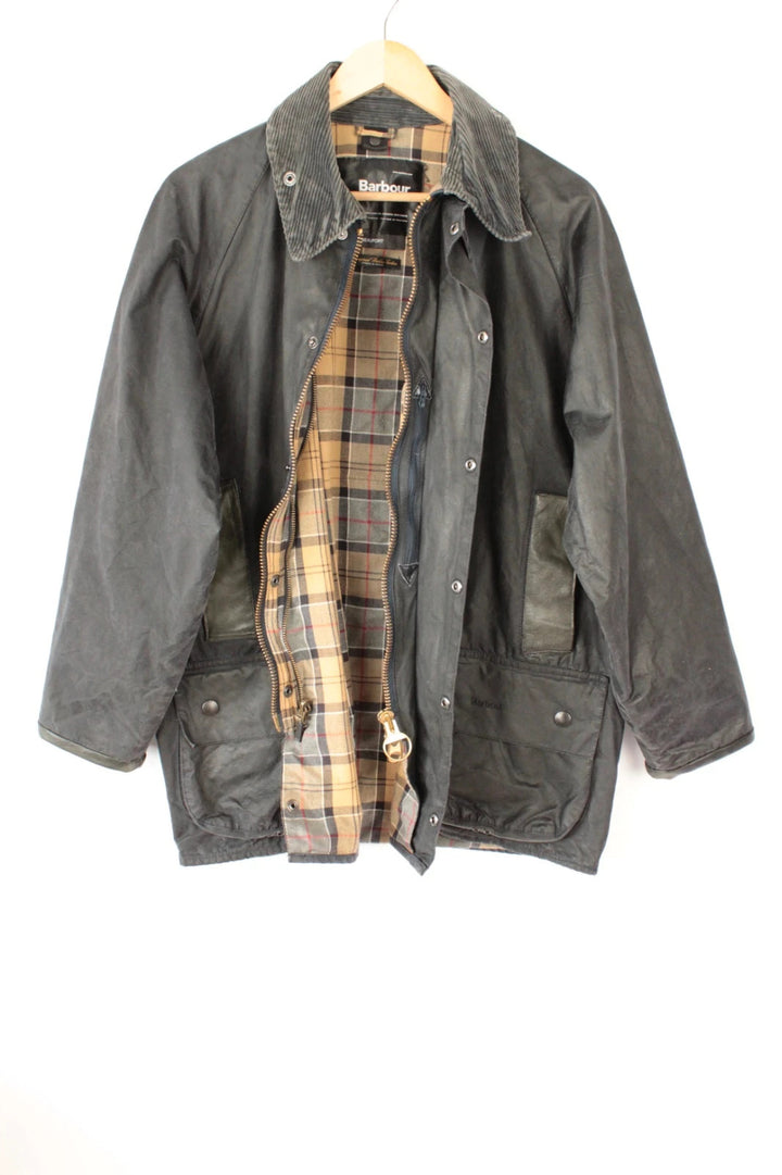 Barbour grey Beaufort wax jacket with navy pocket panels and thick corduroy collar.
