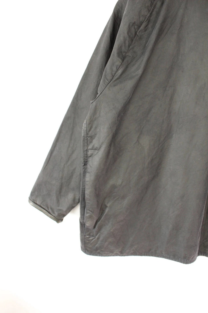 Barbour grey Beaufort wax jacket with navy pocket panels and thick corduroy collar.