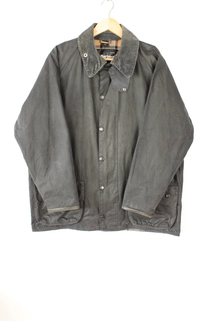 Barbour grey Beaufort wax jacket with navy pocket panels and thick corduroy collar.