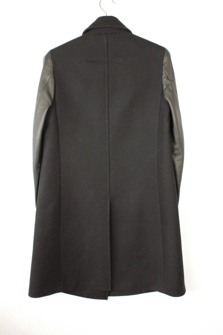 AllSaints black coat with lamb leather sleeves and industrial metal hook buckle fastener.