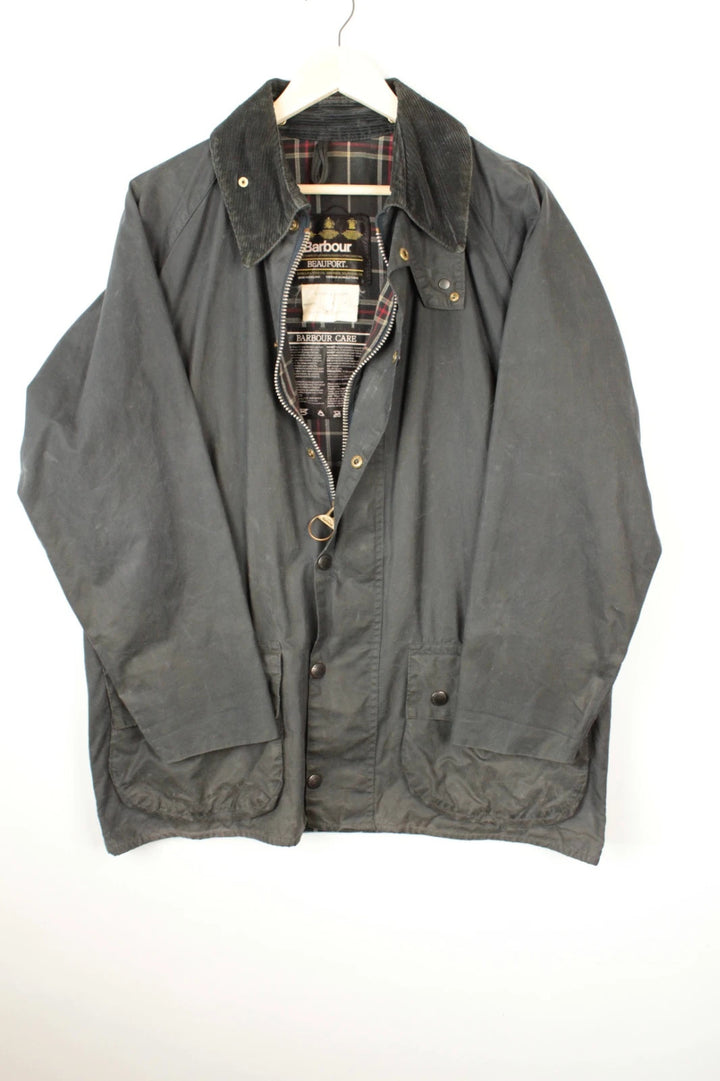 Barbour black and navy waxed cotton jacket with corduroy collar and Levi's patchwork details.