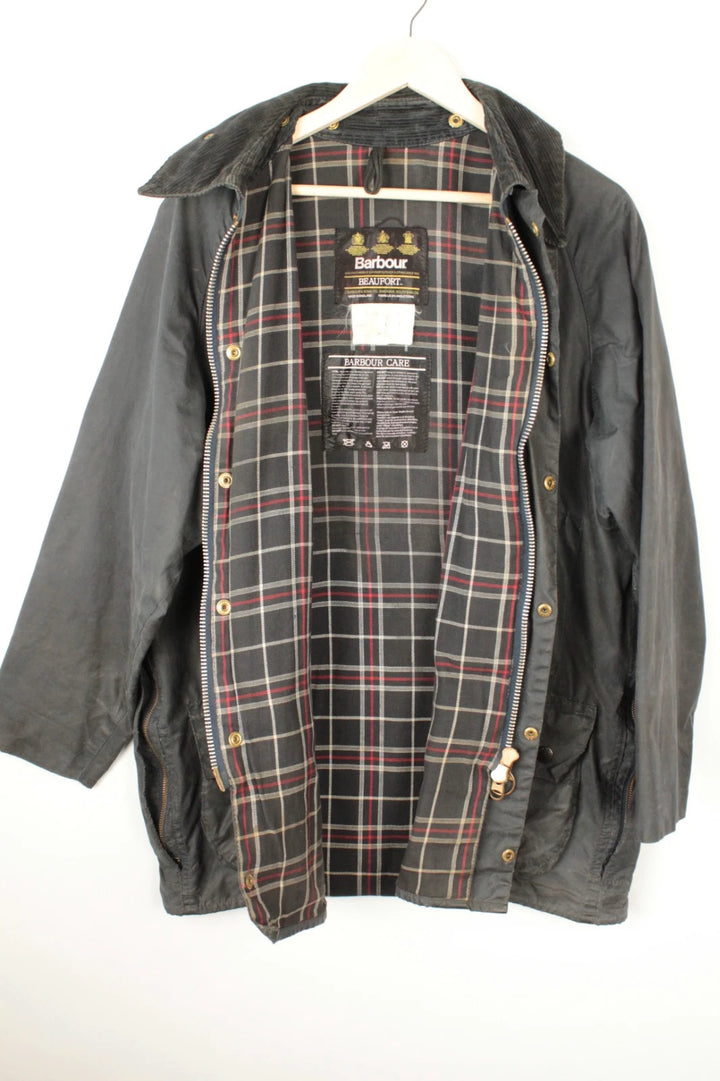 Barbour black and navy waxed cotton jacket with corduroy collar and Levi's patchwork details.
