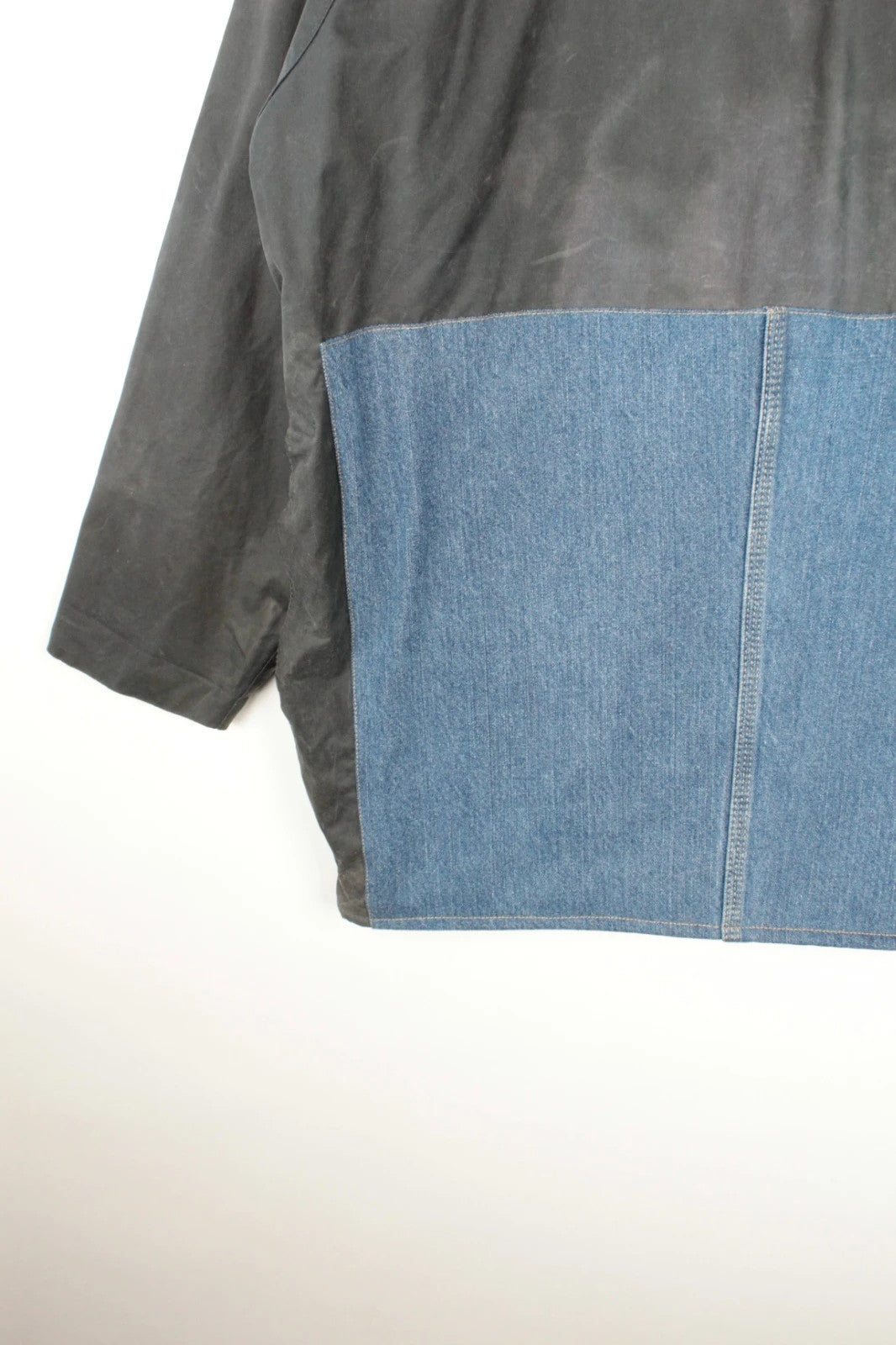 Barbour black and navy waxed cotton jacket with corduroy collar and Levi's patchwork details.