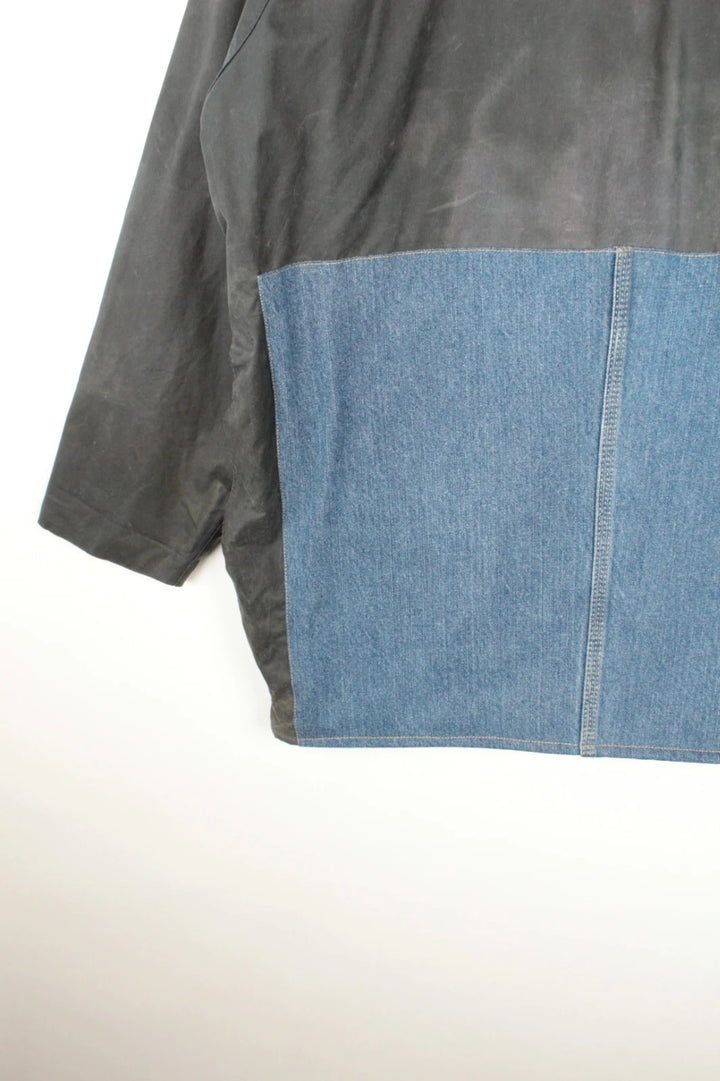 Barbour black and navy waxed cotton jacket with corduroy collar and Levi's patchwork details.