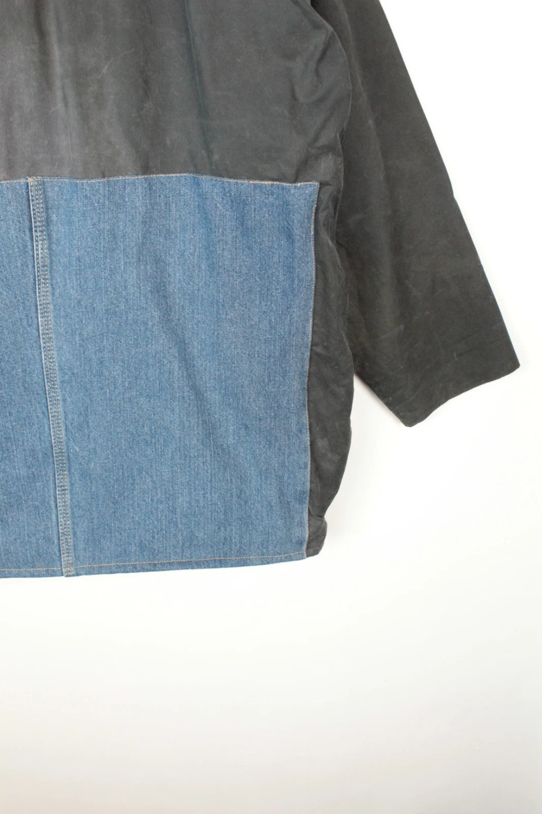 Barbour black and navy waxed cotton jacket with corduroy collar and Levi's patchwork details.