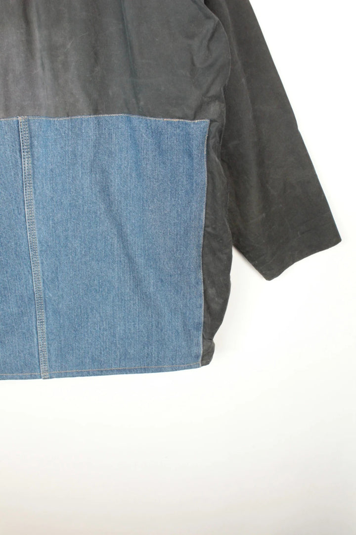 Barbour black and navy waxed cotton jacket with corduroy collar and Levi's patchwork details.