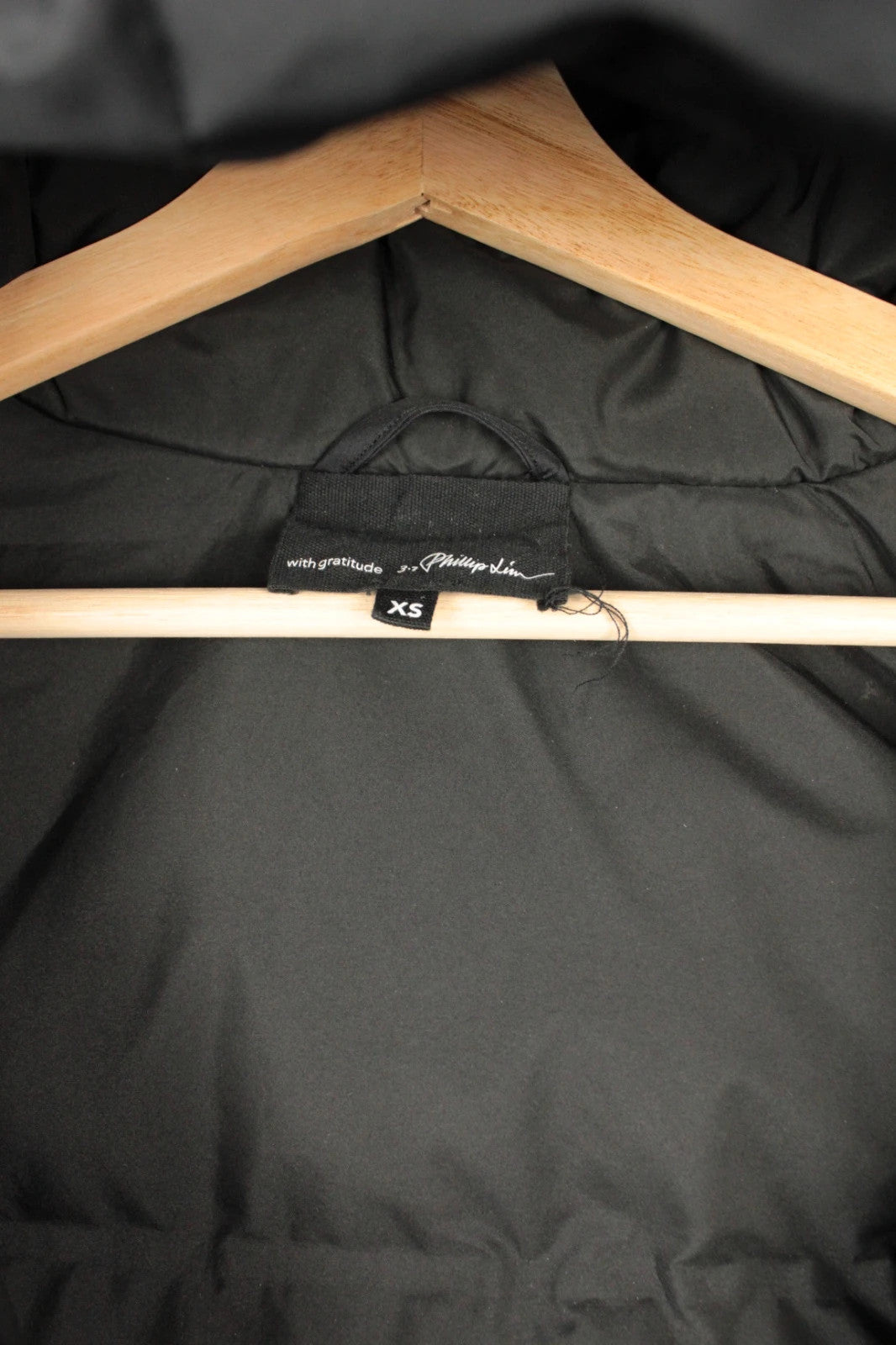 3.1 Phillip Lim black oversized puffer coat with premium nylon taffeta and minimalist design.
