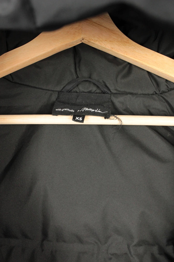 3.1 Phillip Lim black oversized puffer coat with premium nylon taffeta and minimalist design.