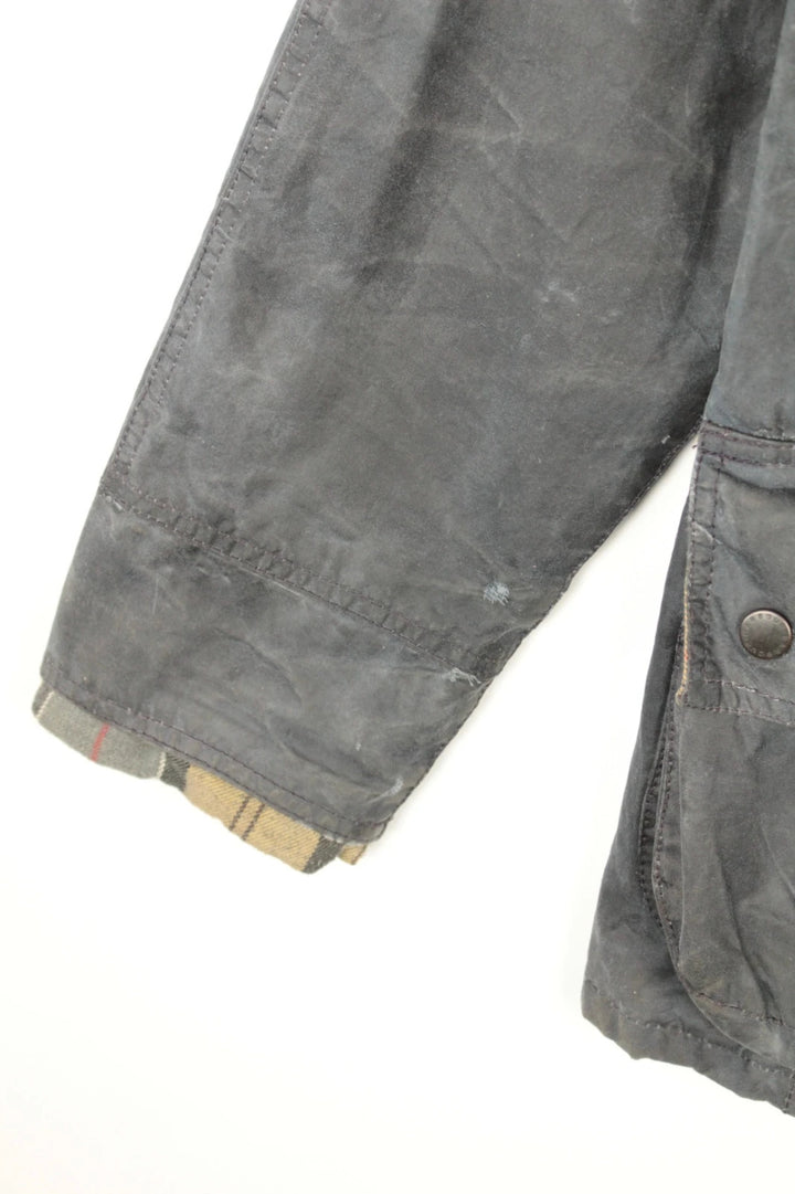 Barbour grey navy waxed cotton jacket with tartan lining and corduroy collar.