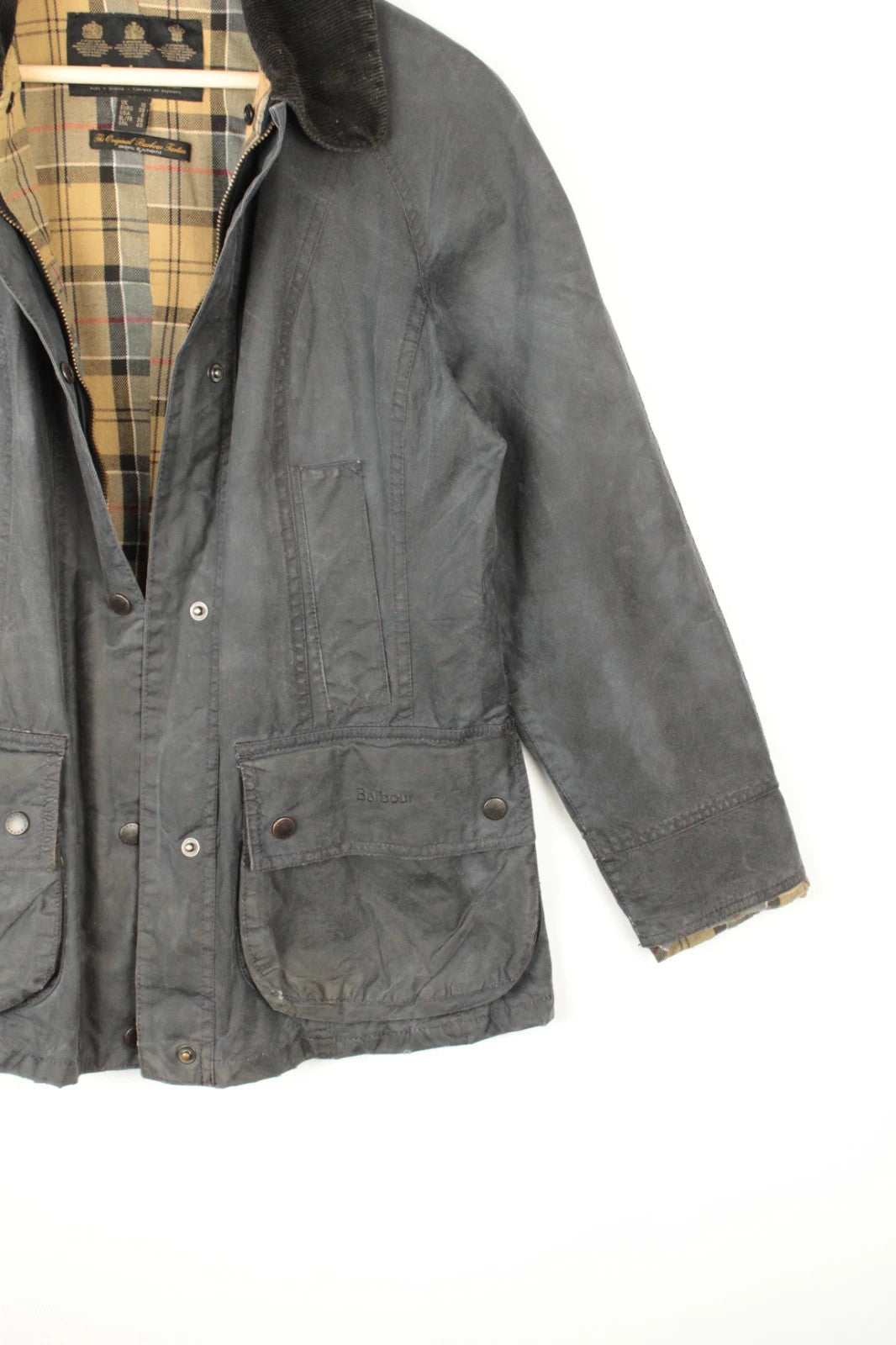 Barbour grey navy waxed cotton jacket with tartan lining and corduroy collar.