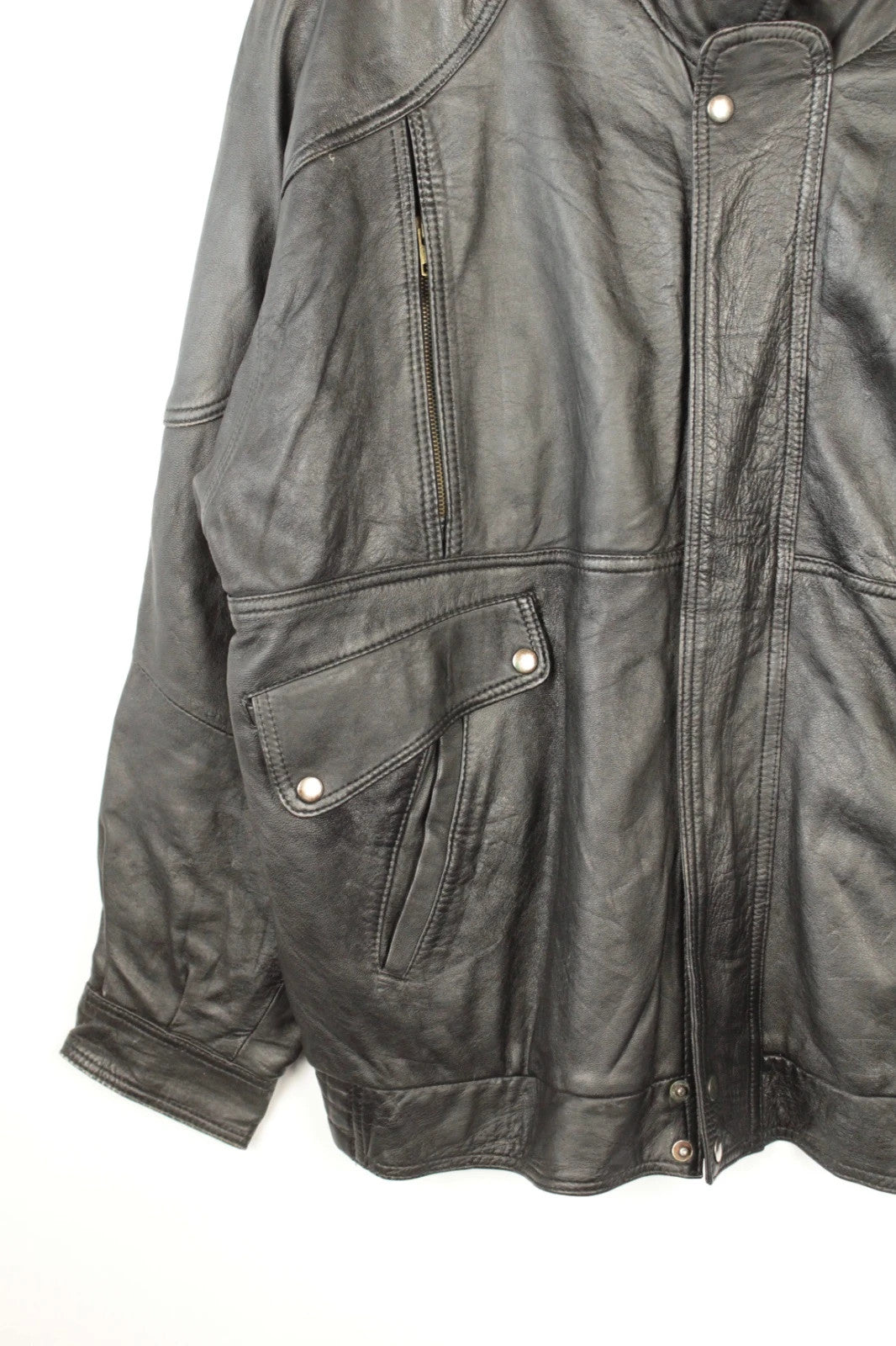 Vintage Dressing black leather bomber jacket with geometric panel stitching and multi-pocket design.