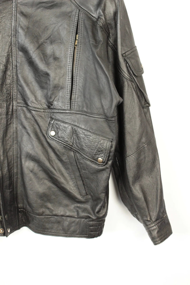 Vintage Dressing black leather bomber jacket with geometric panel stitching and multi-pocket design.