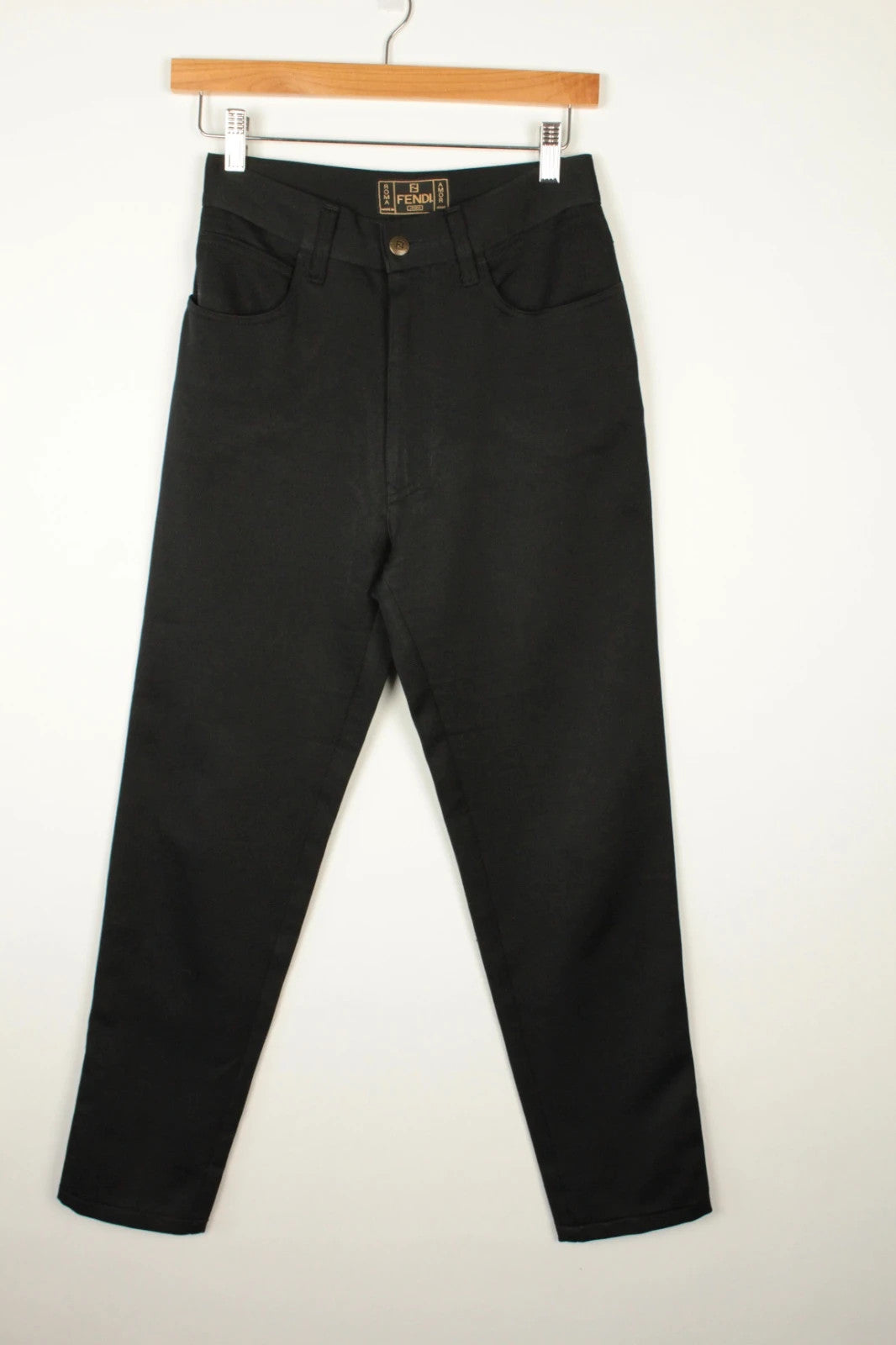 Fendi black wide-leg trousers, high-waisted, premium polyester fabric, 1990s vintage style.