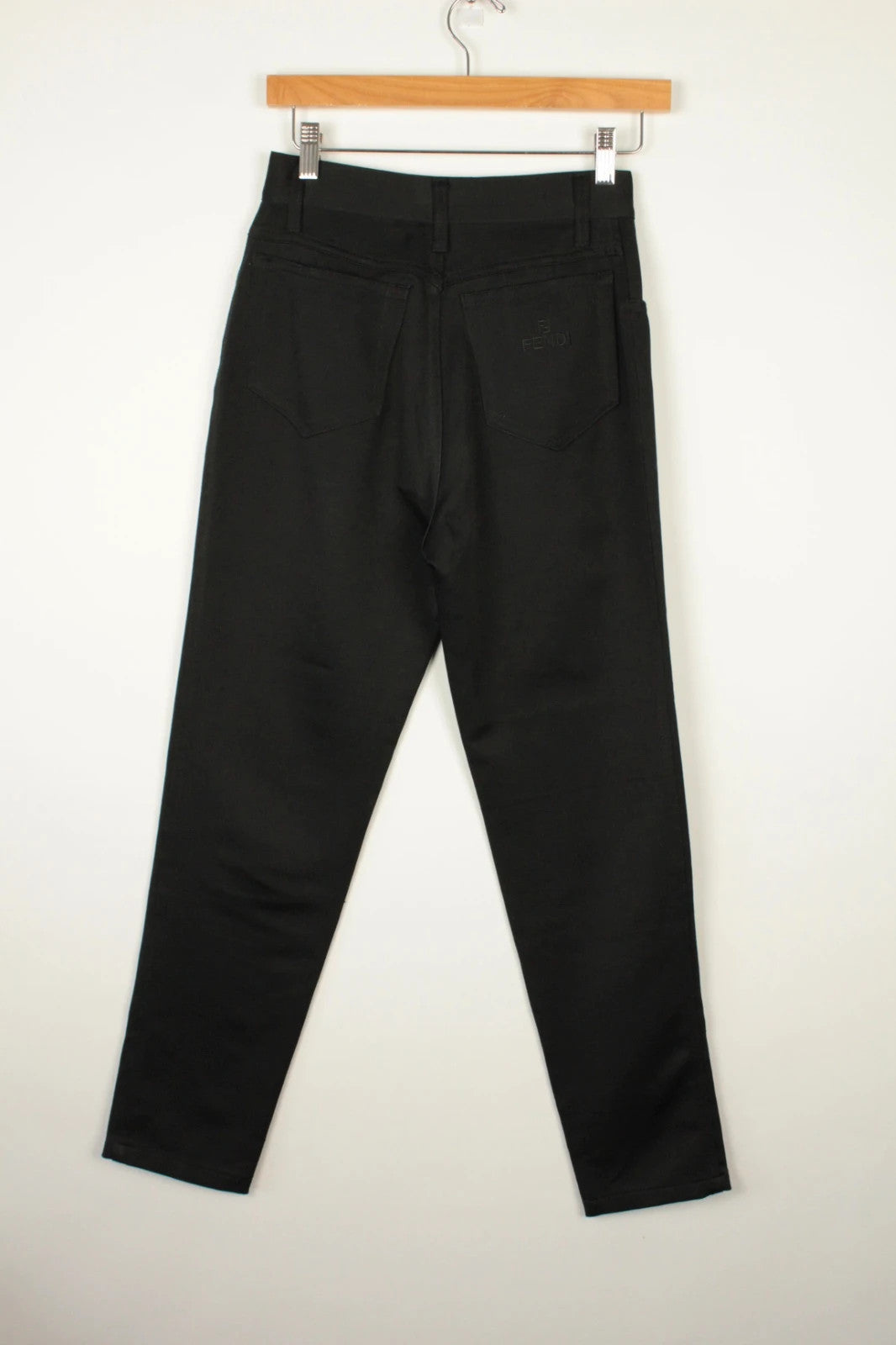 Fendi black wide-leg trousers, high-waisted, premium polyester fabric, 1990s vintage style.