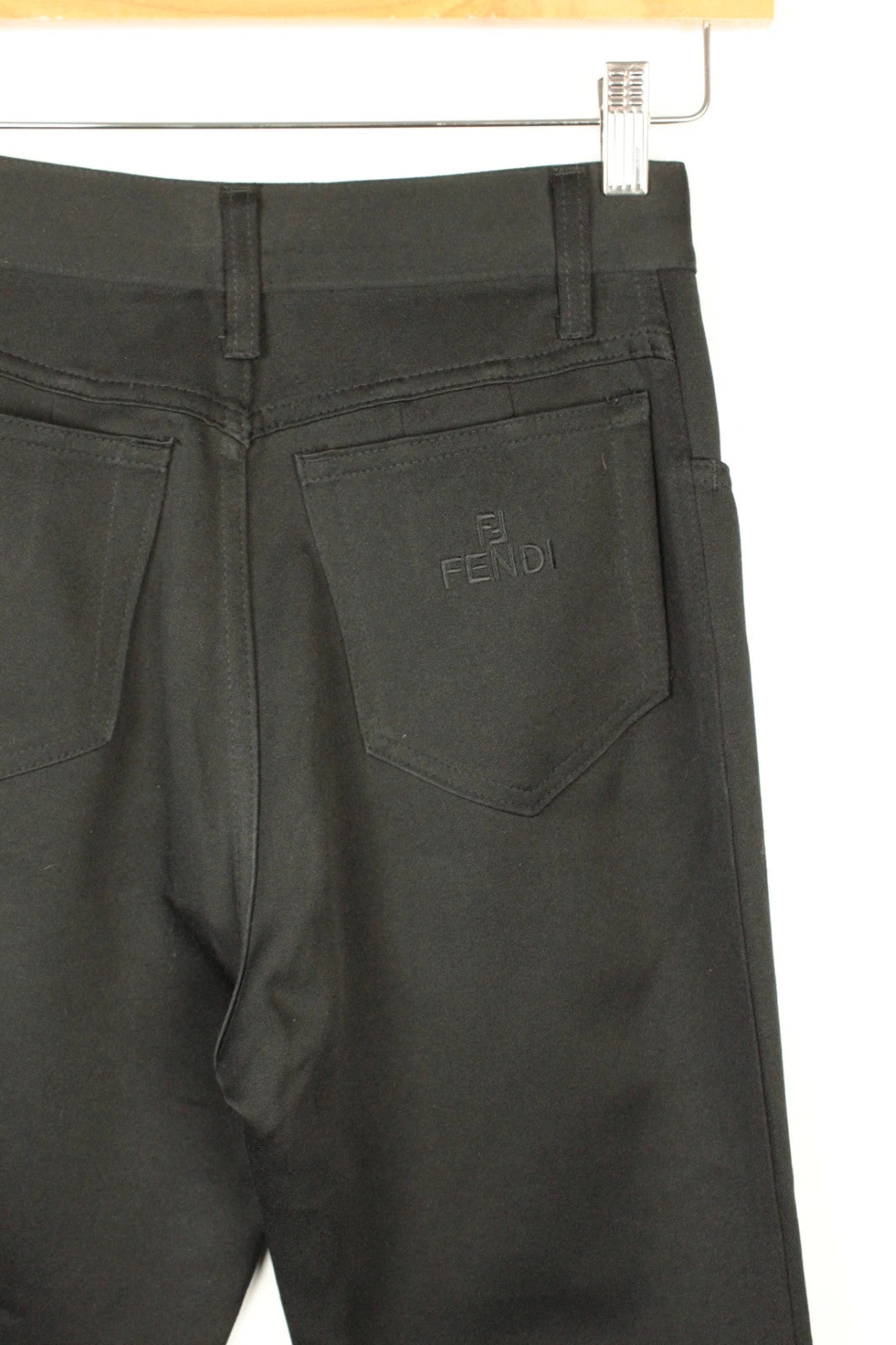 Fendi black wide-leg trousers, high-waisted, premium polyester fabric, 1990s vintage style.