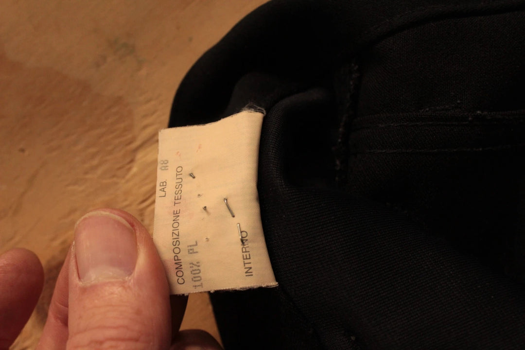 Fendi black wide-leg trousers, high-waisted, premium polyester fabric, 1990s vintage style.