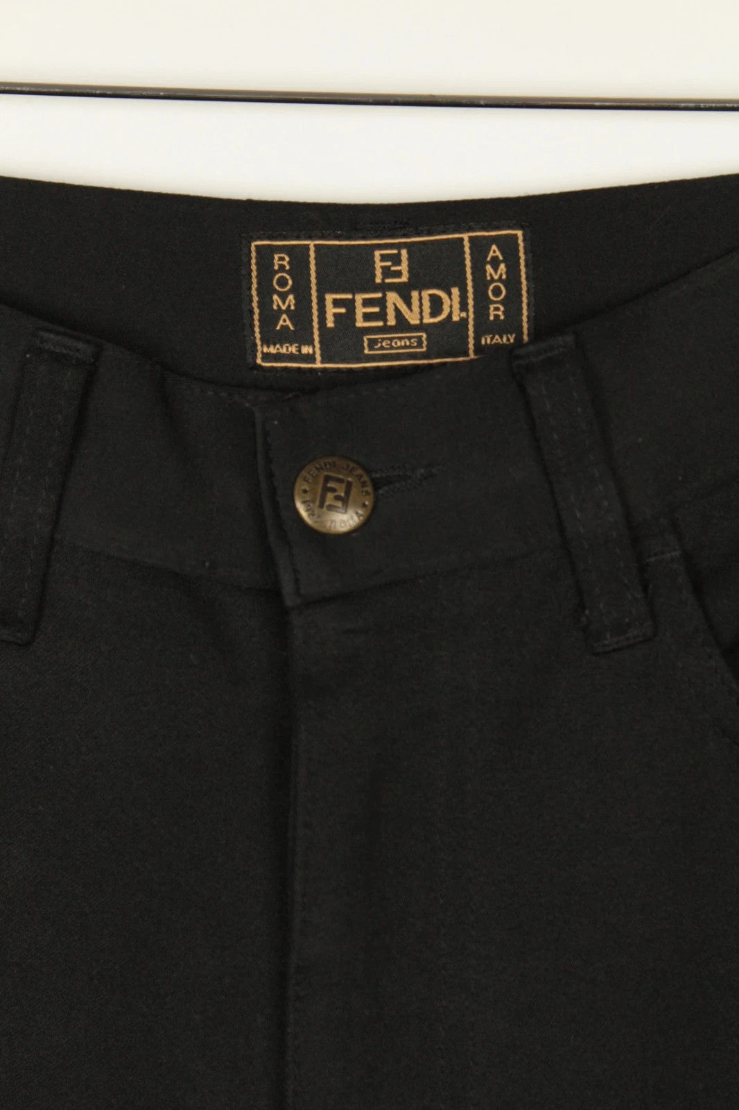 Fendi black wide-leg trousers, high-waisted, premium polyester fabric, 1990s vintage style.