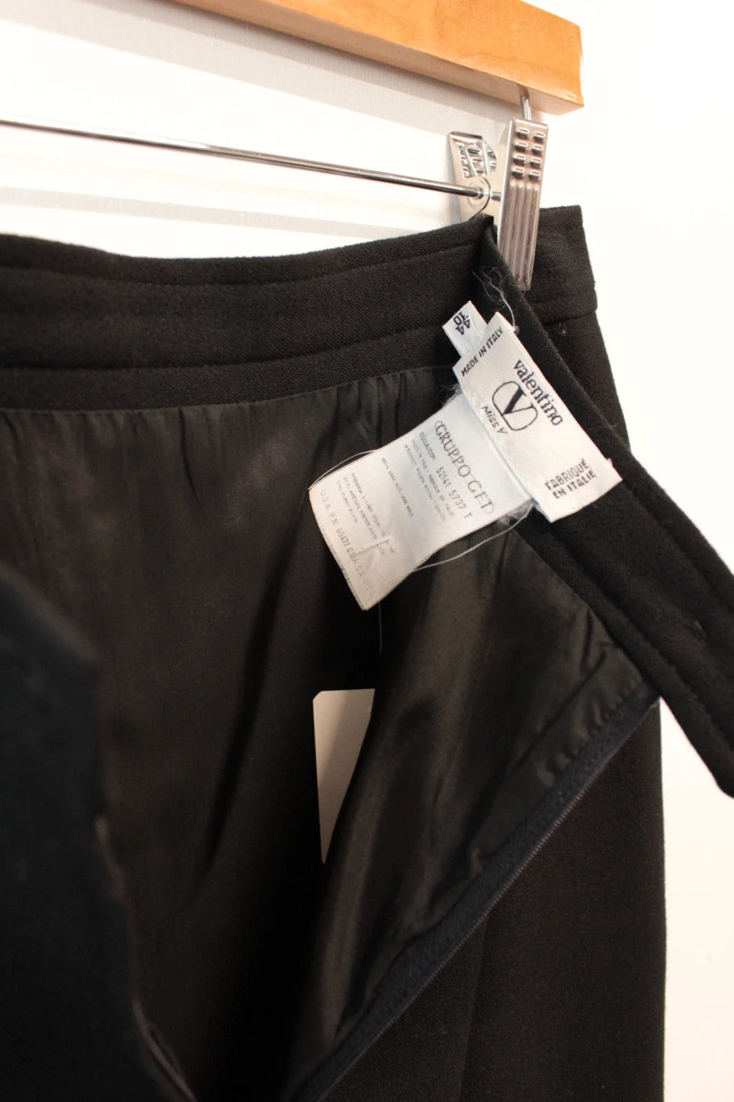 Valentino black wool pencil skirt tailored high waisted with rear vent and zip closure.