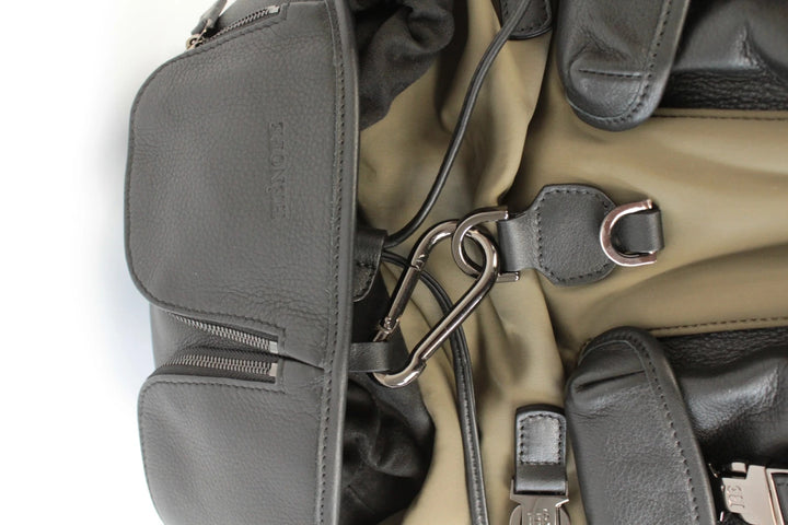 Hènope black and military green neoprene backpack with calf leather trim and gunmetal hardware.
