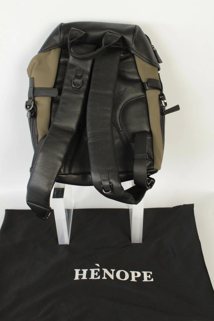 Hènope black and military green neoprene backpack with calf leather trim and gunmetal hardware.