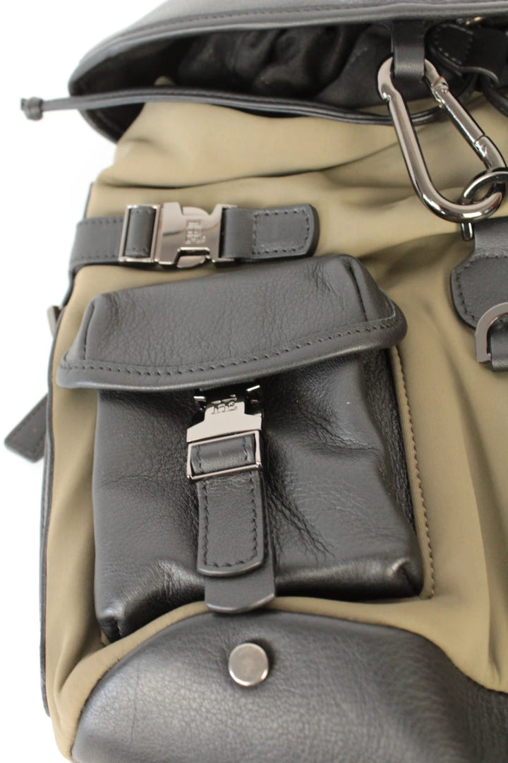 Hènope black and military green neoprene backpack with calf leather trim and gunmetal hardware.