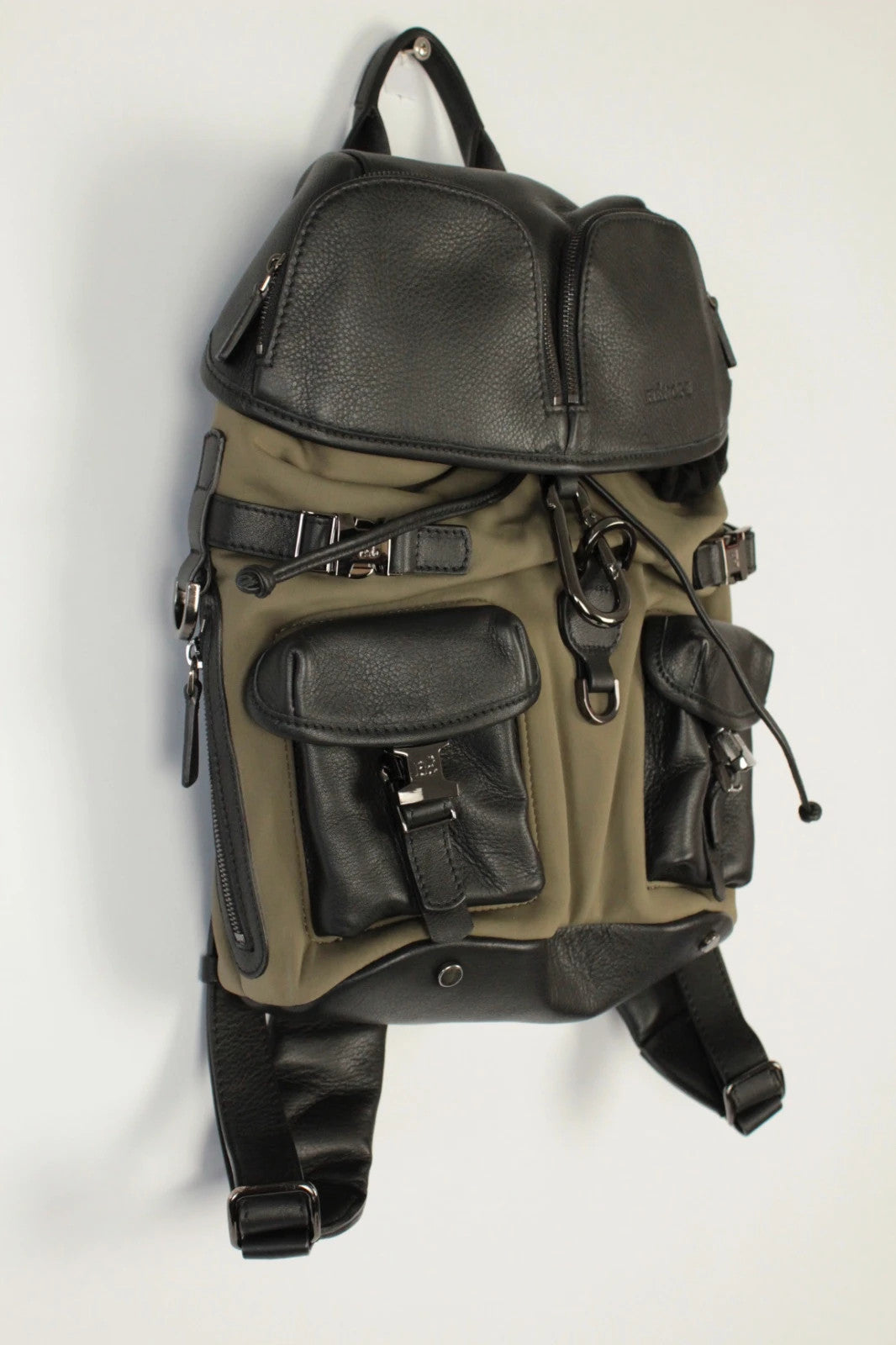 Hènope black and military green neoprene backpack with calf leather trim and gunmetal hardware.
