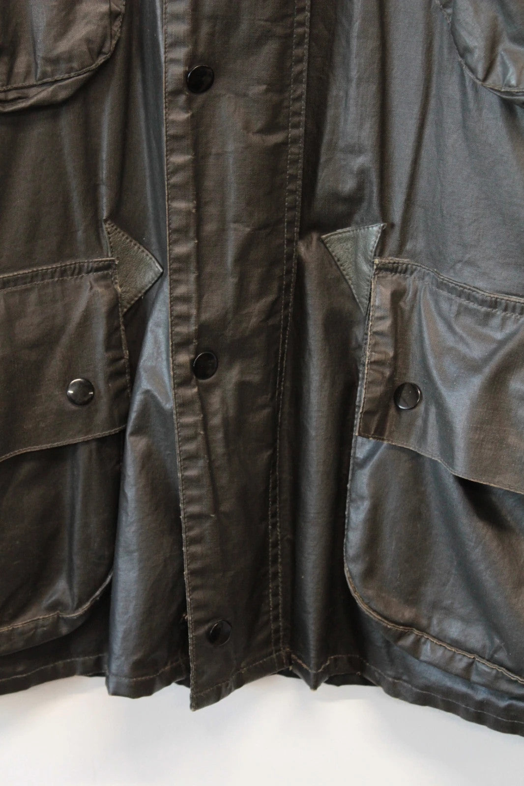Barbour black waxed utility jacket with Gucci leather accents and multi-pocket design.