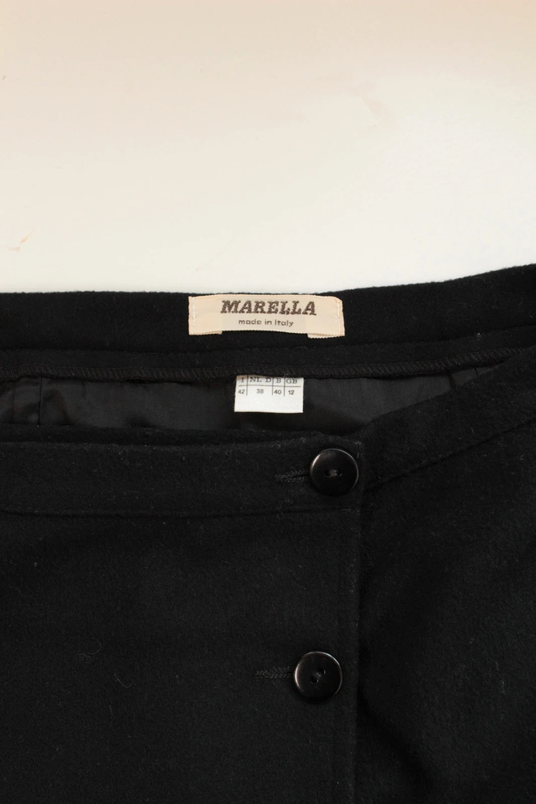 Marella black wool mini skirt tailored button front asymmetric wrap design.