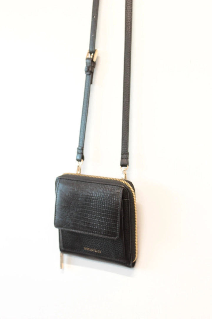 Whistles black lizard effect leather crossbody bag with gold-tone logo and zip hardware.