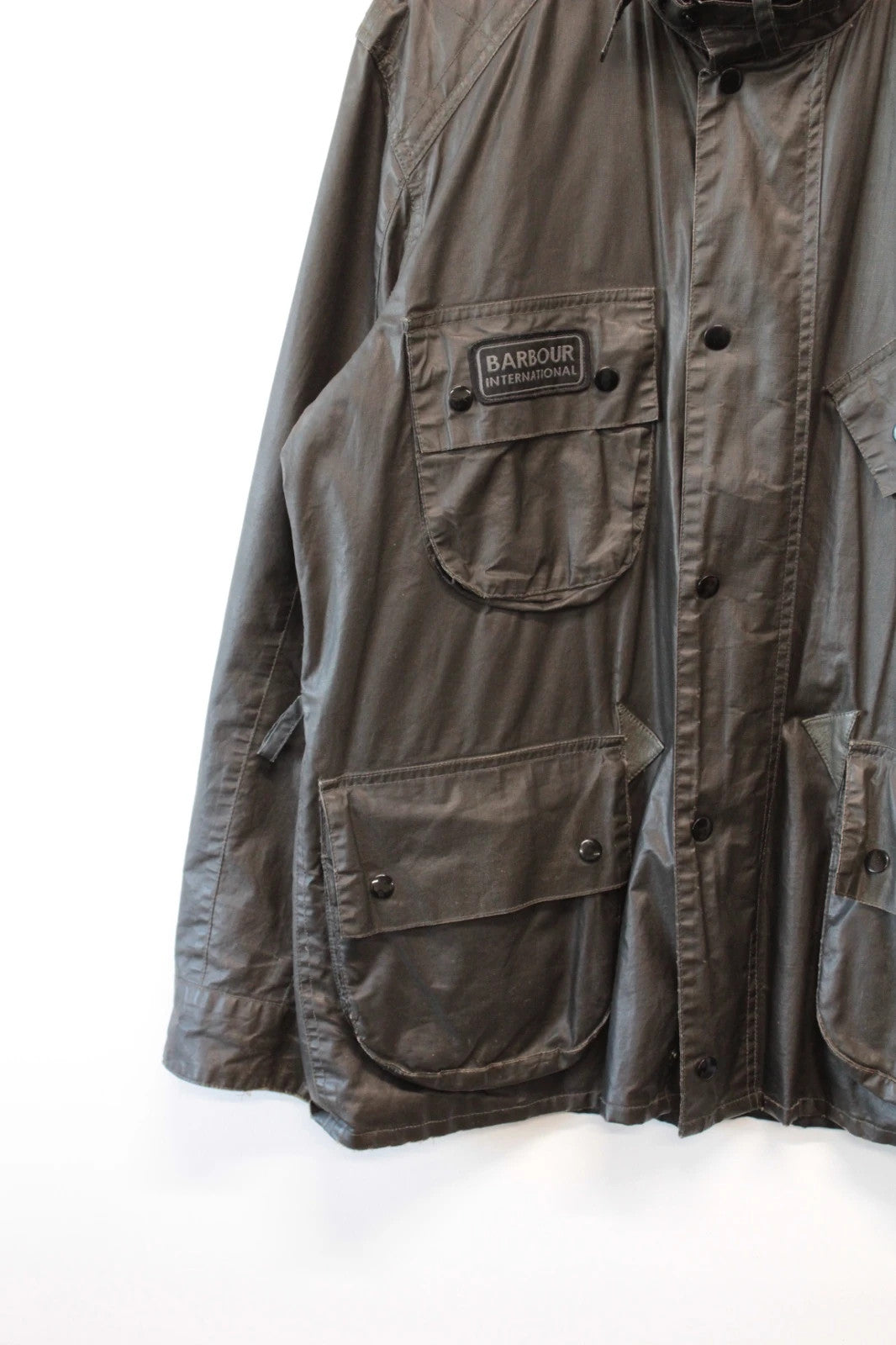 Barbour black waxed utility jacket with Gucci leather accents and multi-pocket design.