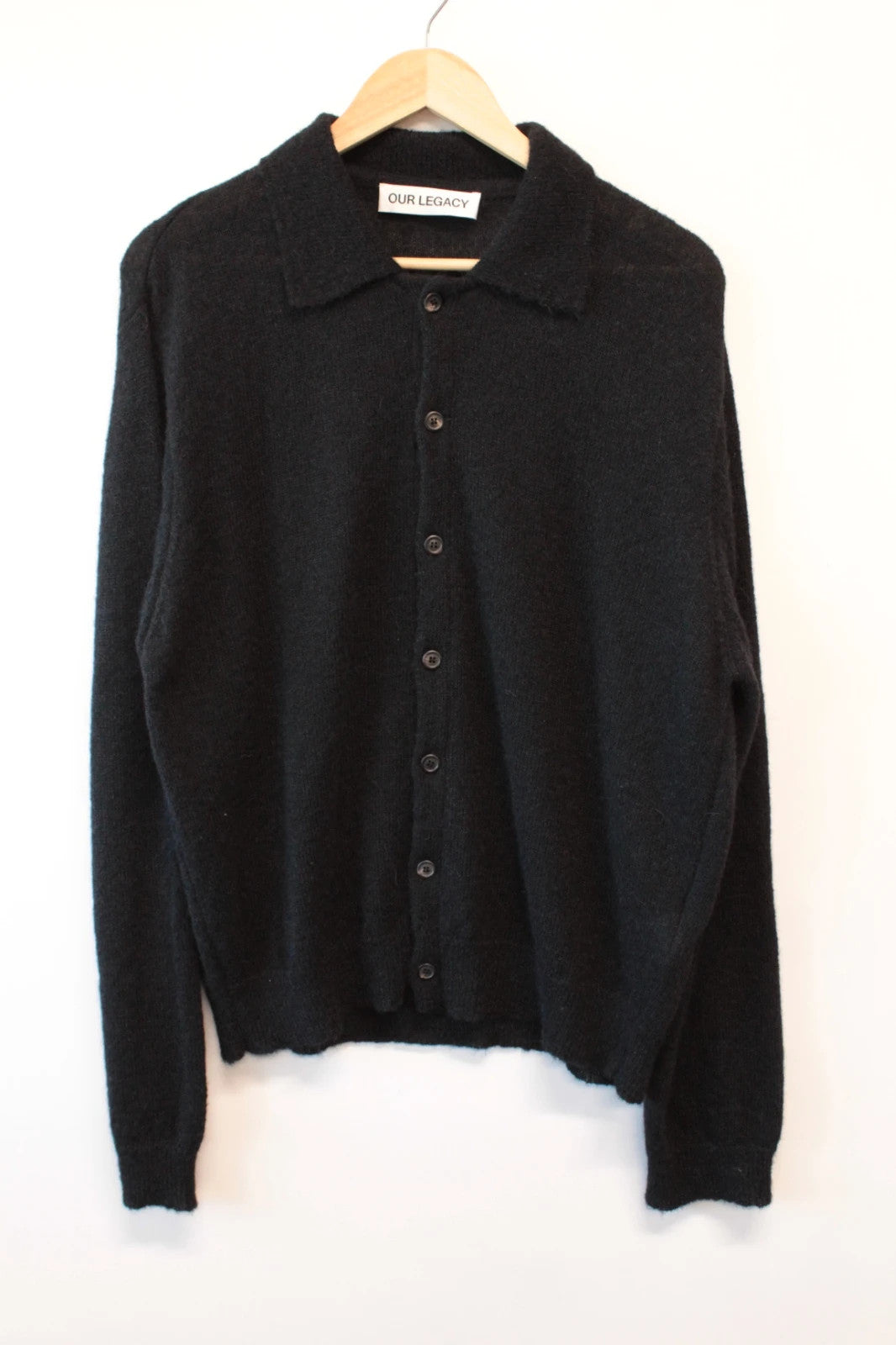 Our Legacy black mohair cardigan with classic collar and tonal buttons.