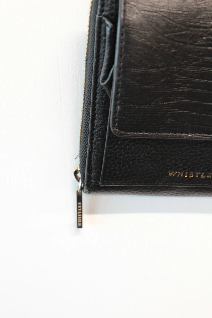 Whistles black lizard effect leather crossbody bag with gold-tone logo and zip hardware.