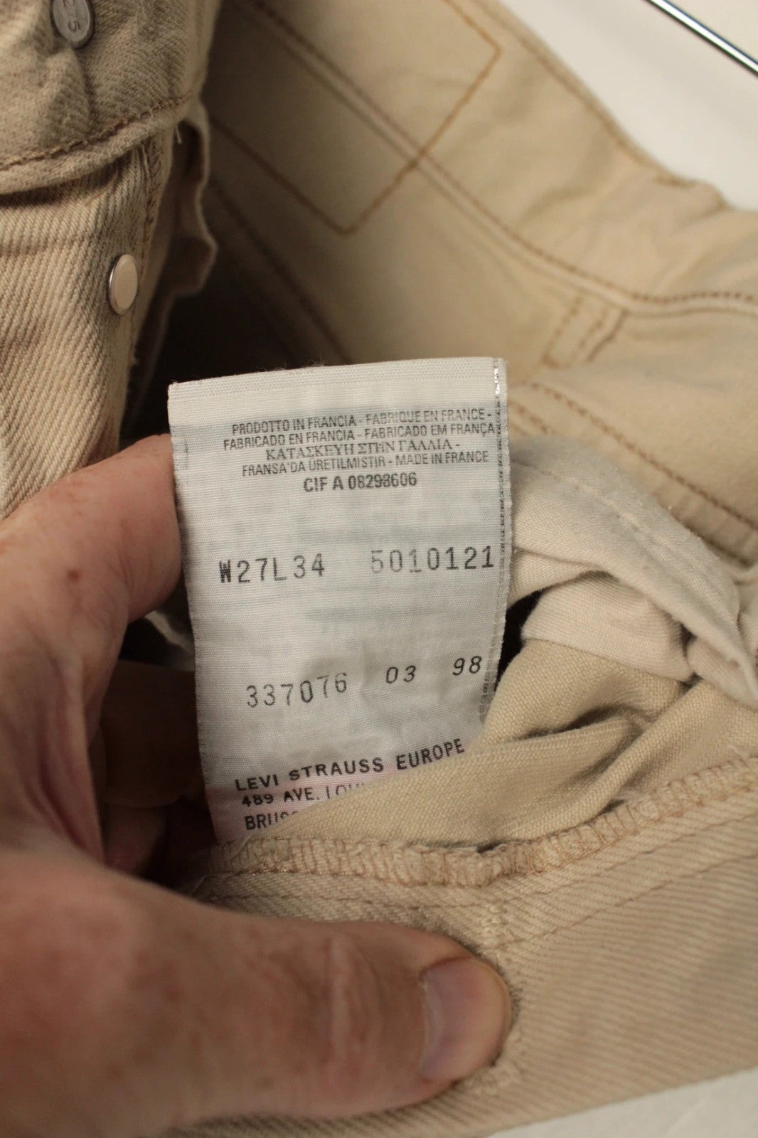 Levi's beige straight jeans with button fly and vintage 501 label, made in France.