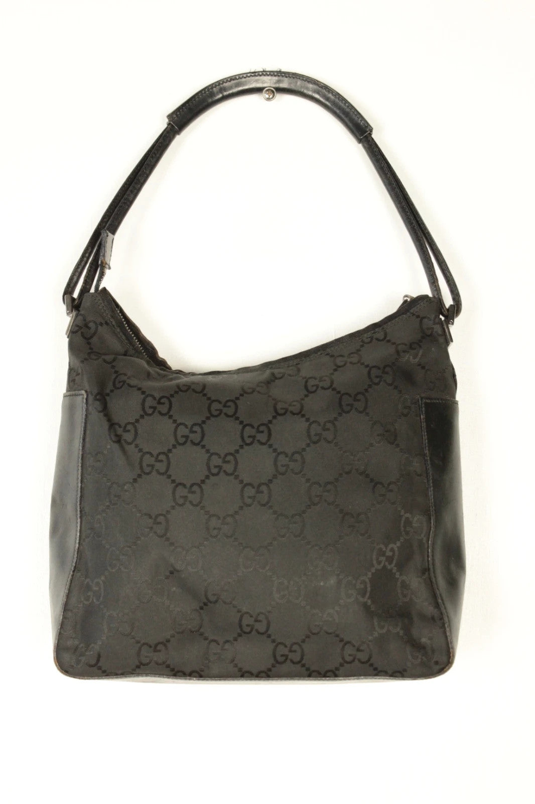Gucci black hobo bag with GG monogram canvas, calf leather trim, and silver-tone hardware.