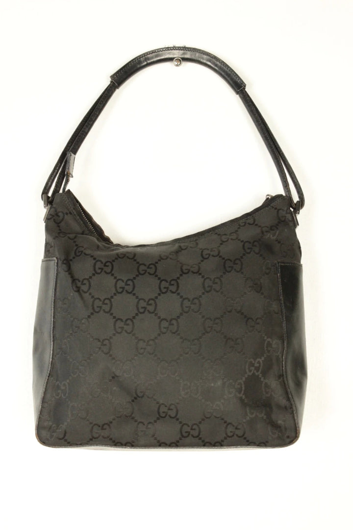 Gucci black hobo bag with GG monogram canvas, calf leather trim, and silver-tone hardware.