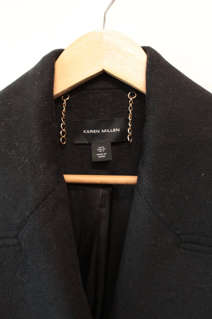 Karen Millen black double-breasted pea coat with tailored silhouette and gold hanging chain.