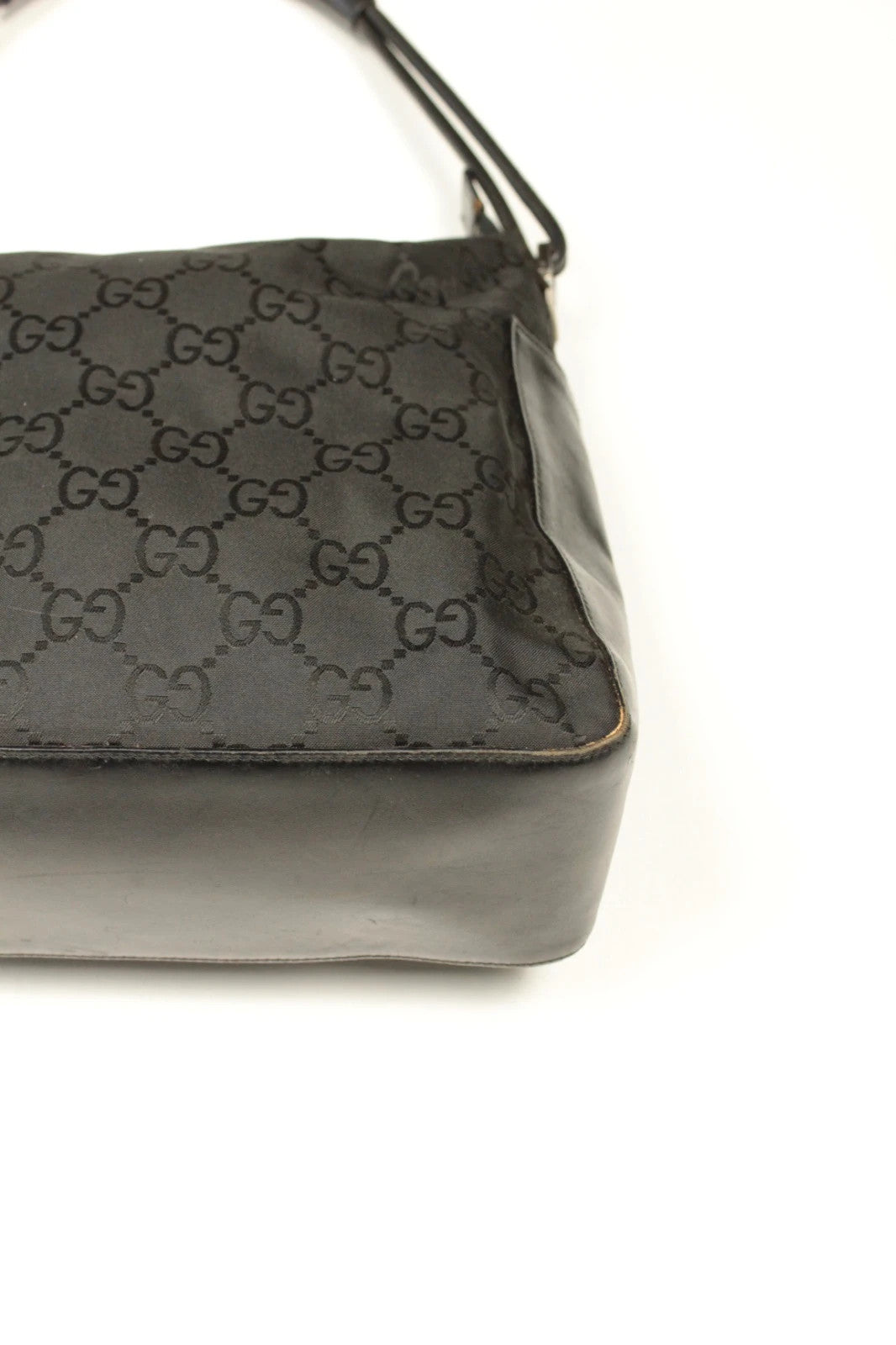 Gucci black hobo bag with GG monogram canvas, calf leather trim, and silver-tone hardware.