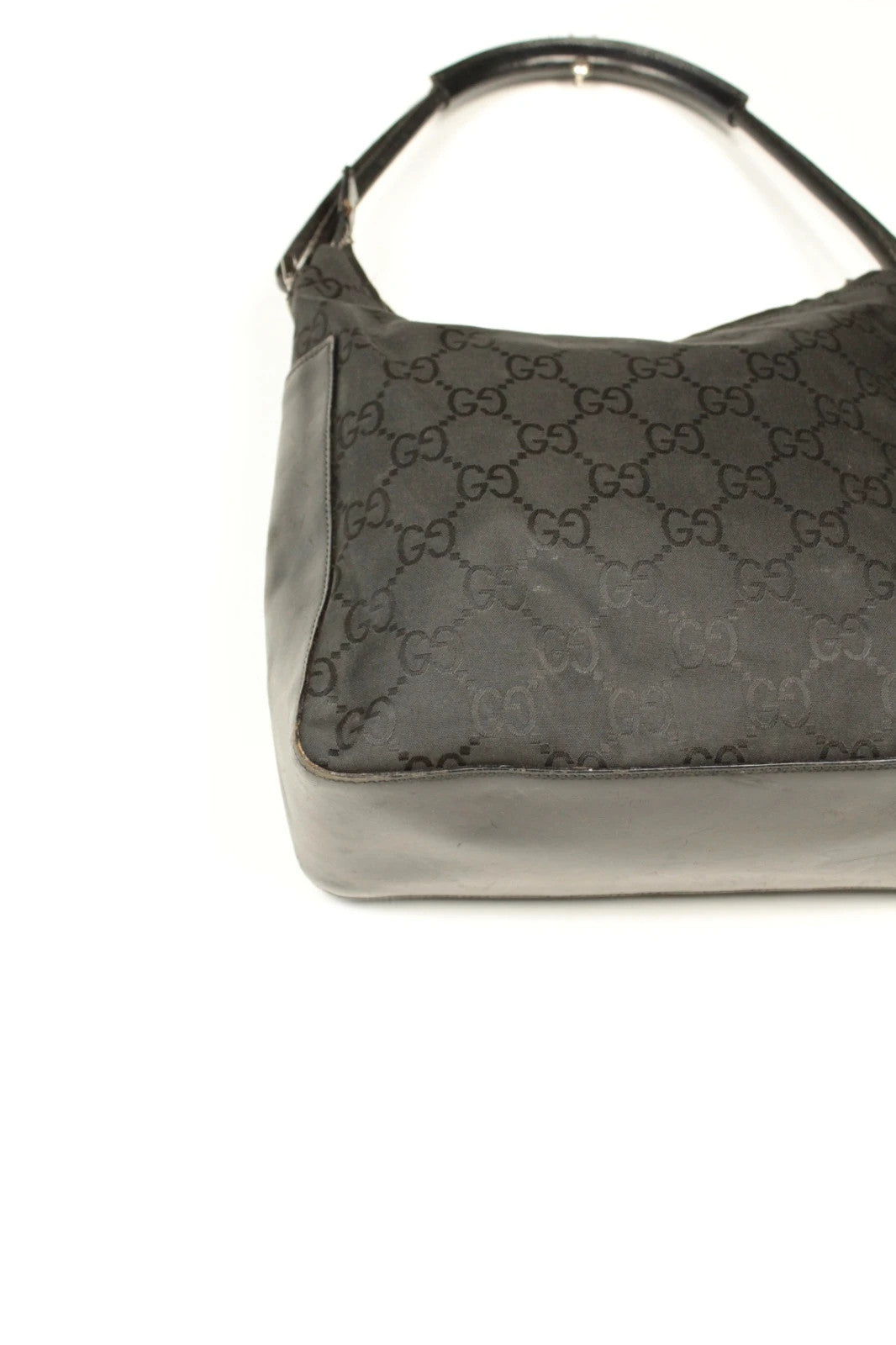 Gucci black hobo bag with GG monogram canvas, calf leather trim, and silver-tone hardware.