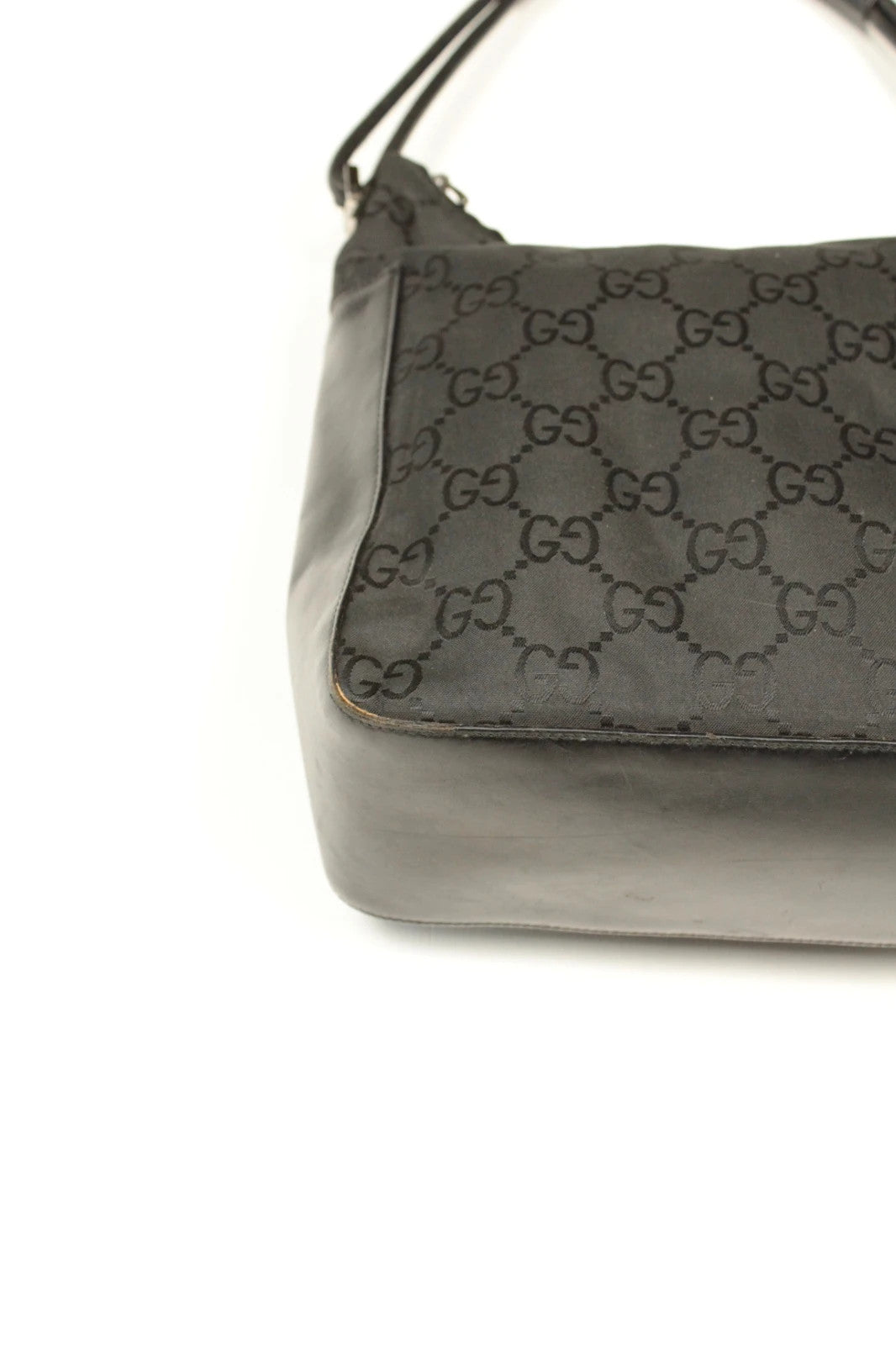 Gucci black hobo bag with GG monogram canvas, calf leather trim, and silver-tone hardware.