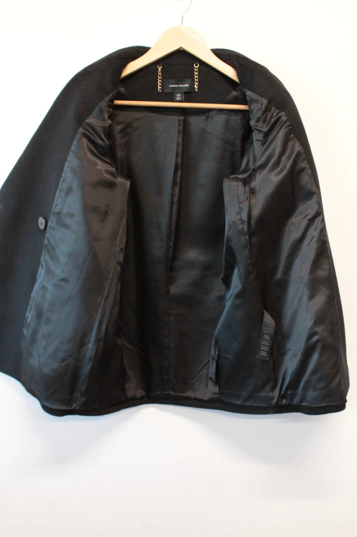 Karen Millen black double-breasted pea coat with tailored silhouette and gold hanging chain.