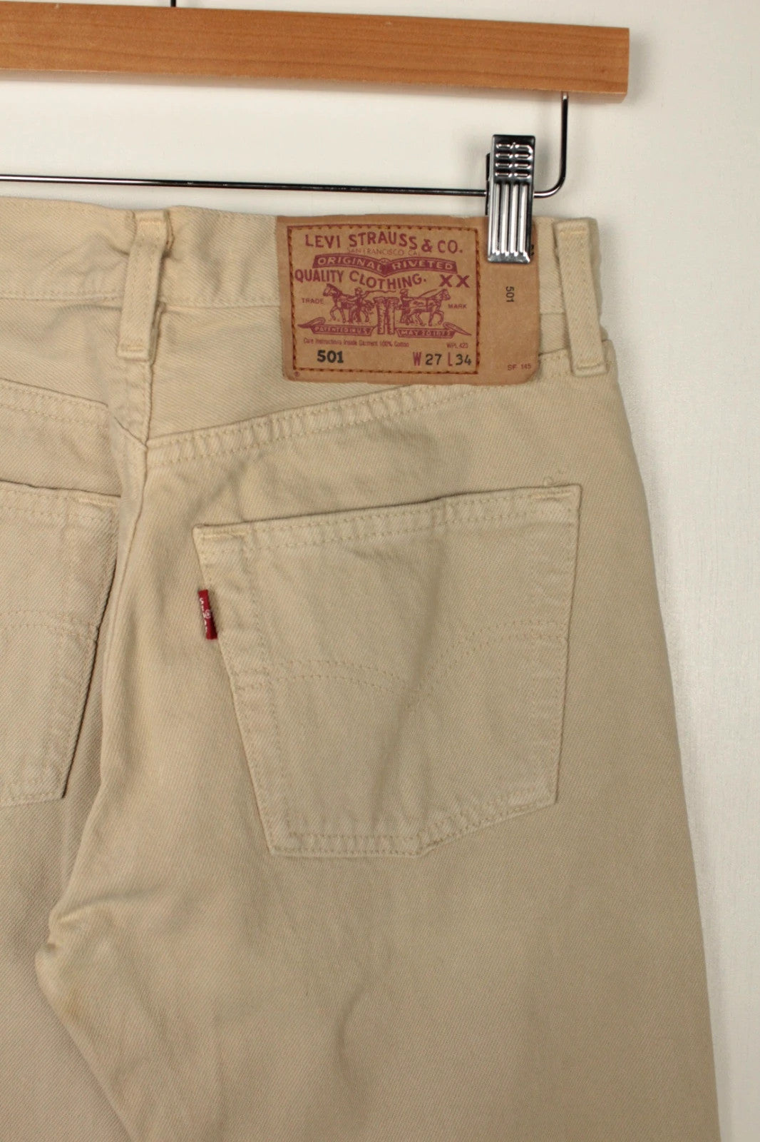 Levi's beige straight jeans with button fly and vintage 501 label, made in France.