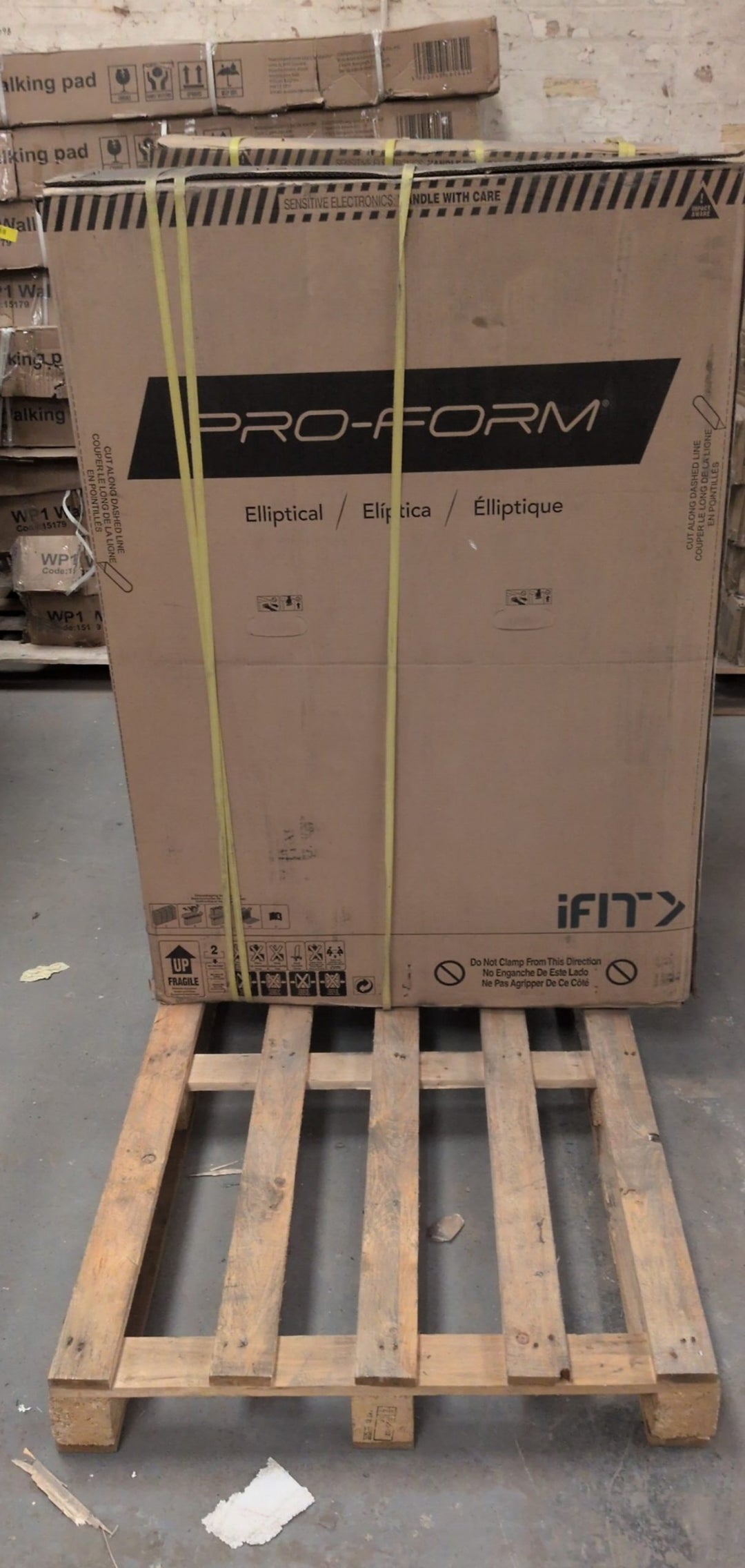 Pro-Form elliptical trainer in sealed packaging with iFit compatibility for interactive workouts.