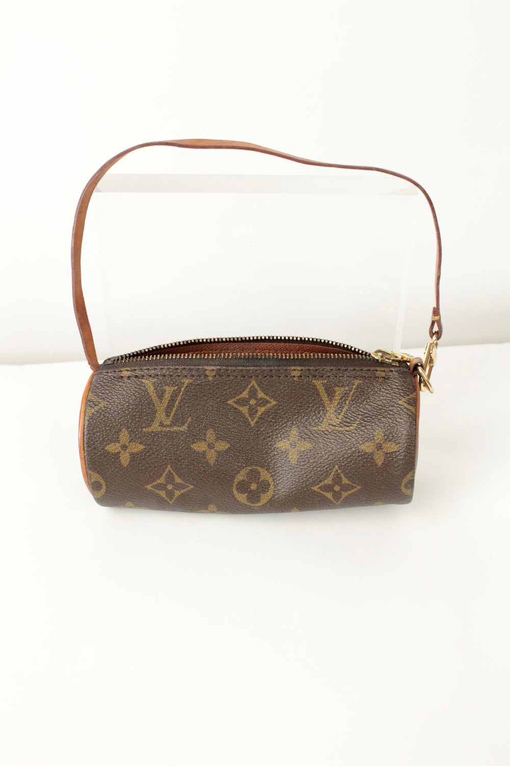Louis Vuitton brown micro mini pouch bag with monogram pattern and vachetta leather trim.